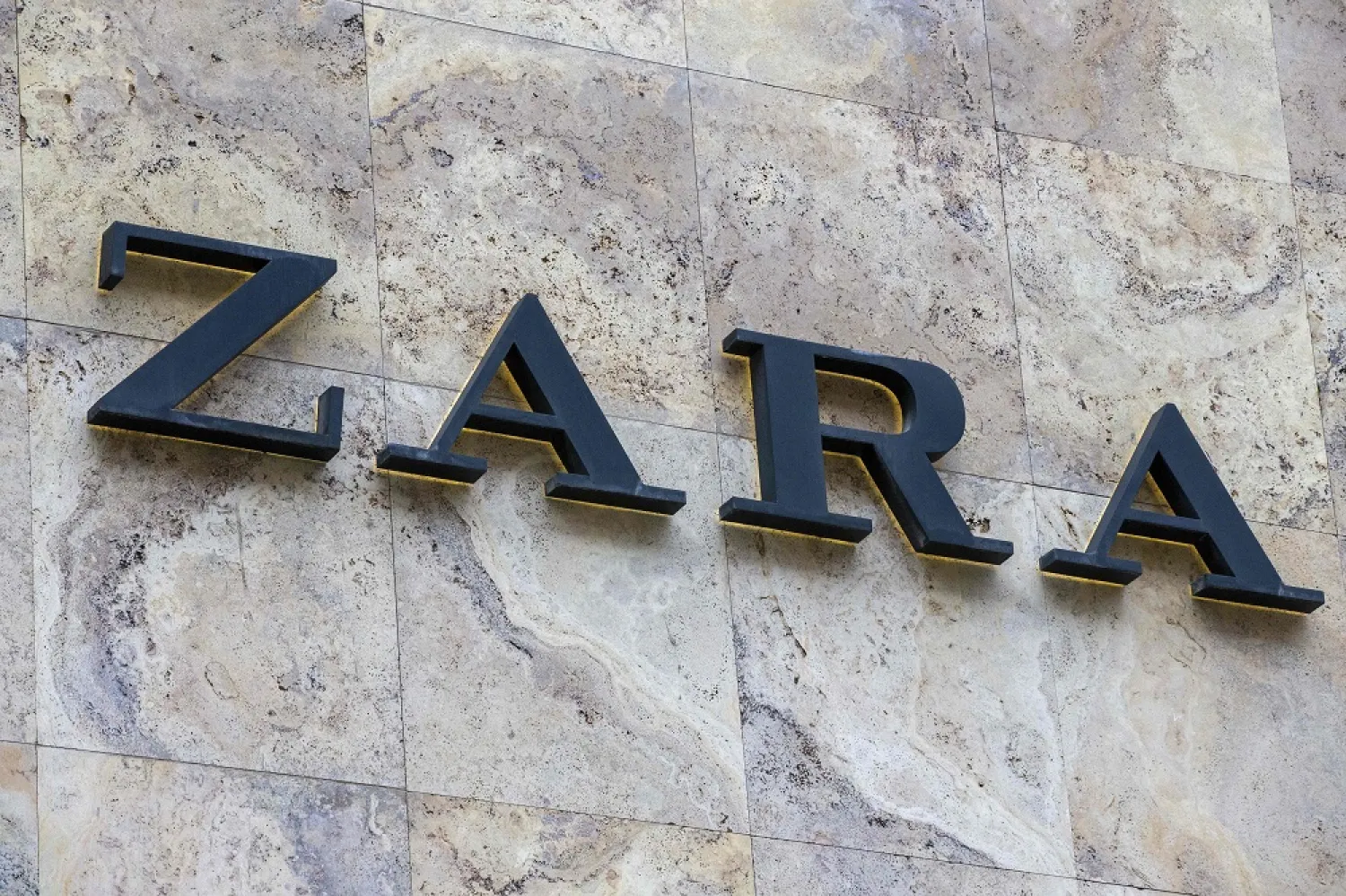 This photograph shows the logo of Zara retail clothing chain on a store building in Brussels on February 18, 2023. (AFP)
