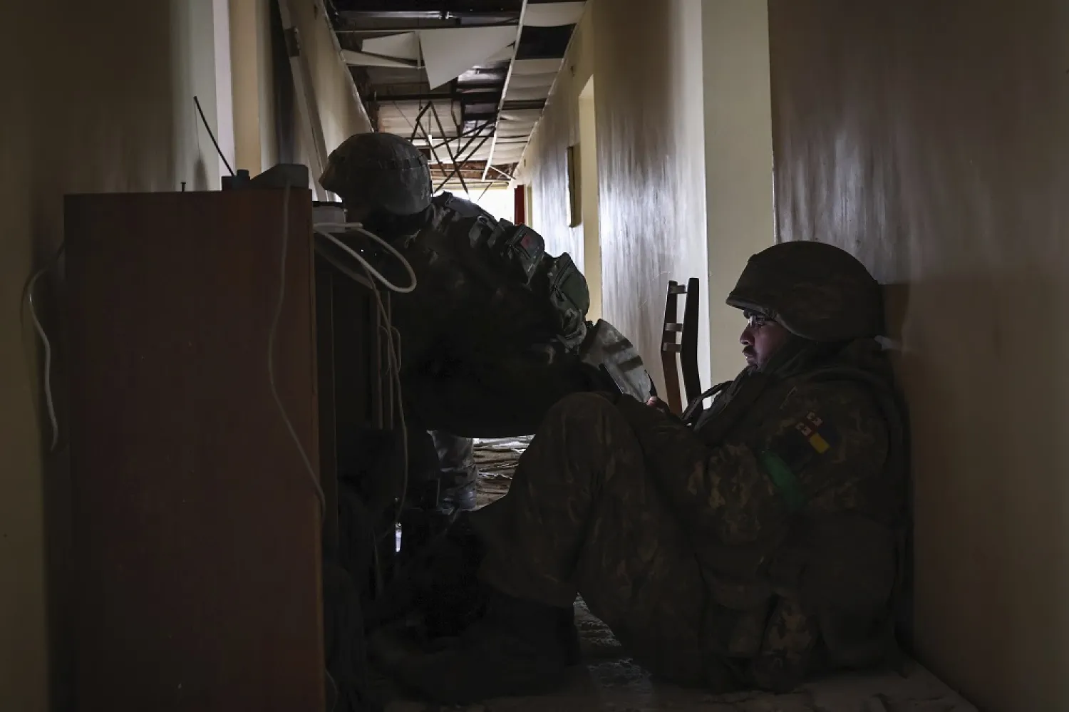 Ukrainian soldiers take a break in building in the area of the heaviest battles with the Russian invaders in Bakhmut, Donetsk region, Ukraine, Wednesday, March 15, 2023. (AP) 