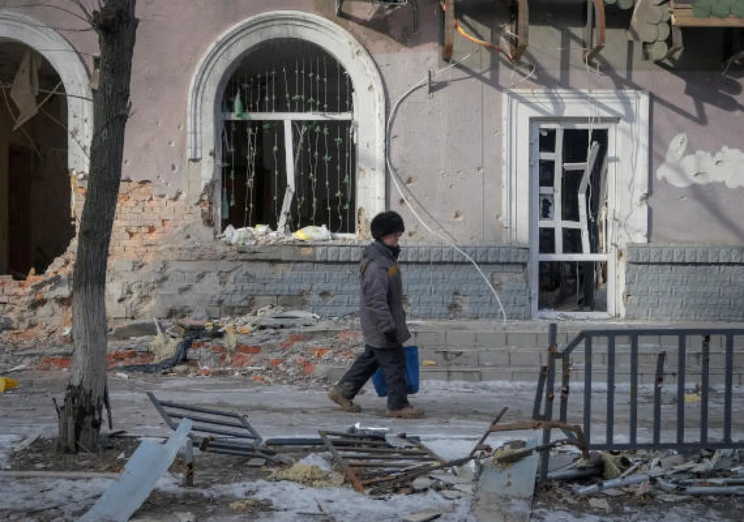 FILE PHOTO: A local resident walks an empty street, as Russia's attack on Ukraine continues, in the front line city of Bakhmut, Ukraine February 24, 2023. REUTERS/Alex Babenko/File Photo
