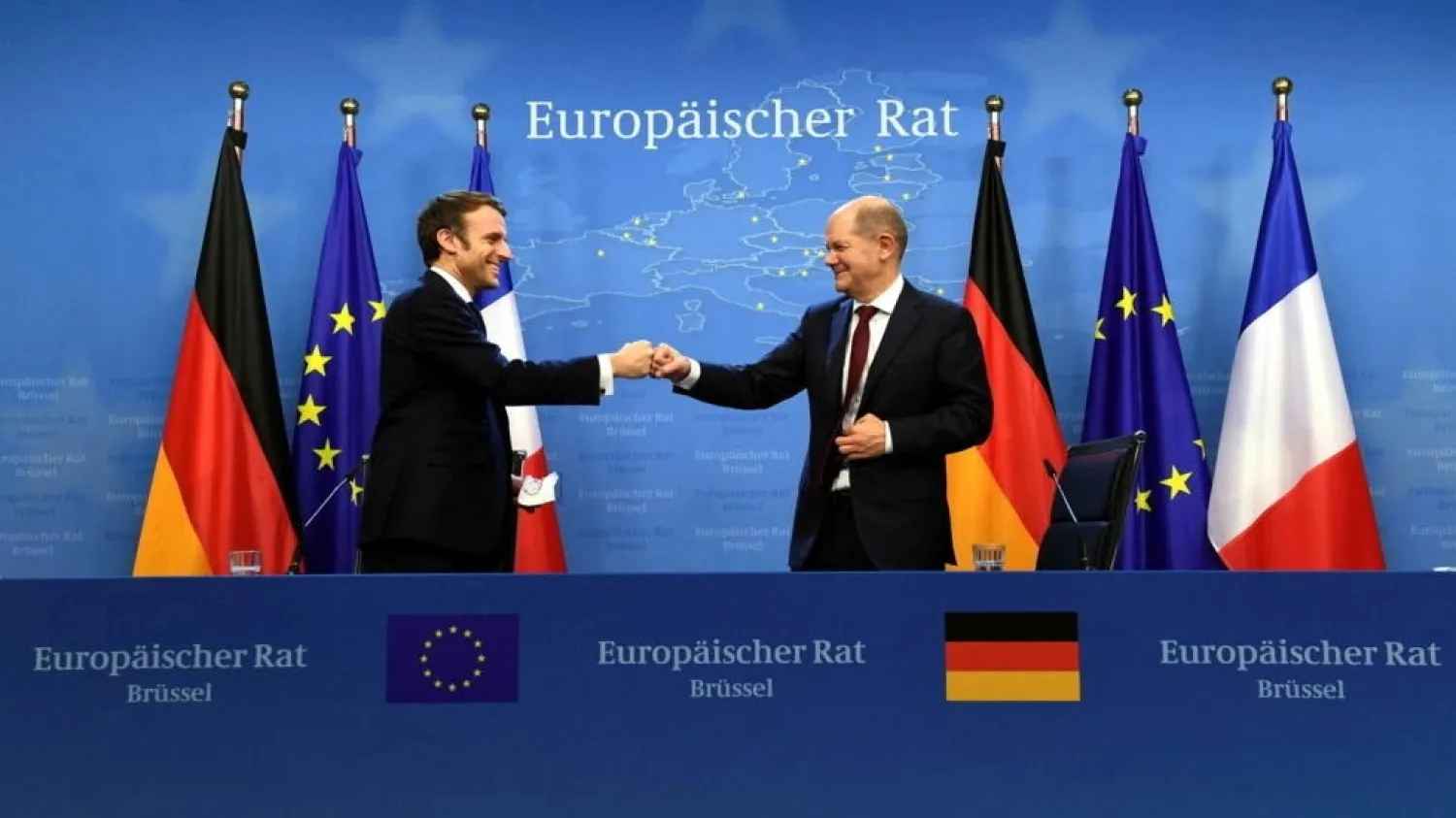 France's President Emmanuel Macron and Germany's Chancellor Olaf Scholz bump fists after holding a joint news conference at the conclusion of an EU Summit in Brussels, Belgium December 17, 2021. Reuters (pool)
