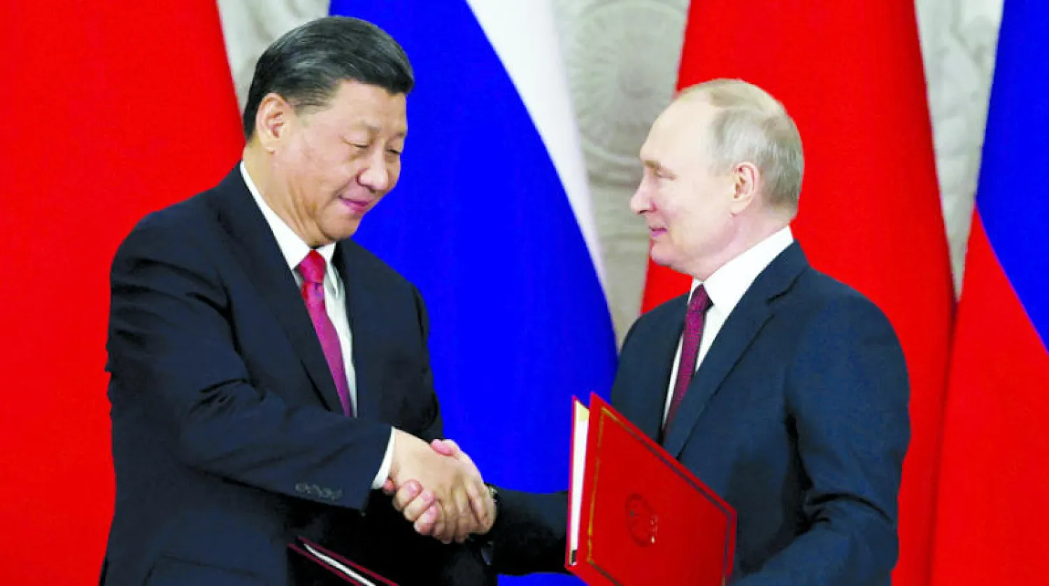 بوتين وشي خلال قمتهما في موسكو في 21 مارس (رويترز)