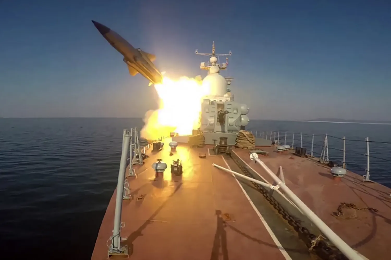 This grab taken from a footage released by the Russian Defense Ministry on March 28, 2023 shows a missile boat of the Pacific Fleet firing a Moskit cruise missile at a mock enemy sea target in the Sea of Japan during military exercises. (Handout / Russian Defense Ministry / AFP)
