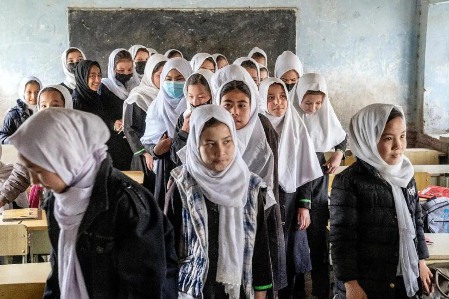 Girls stand in their classroom on the first day of the new school year, in Kabul, Saturday, March 25, 2023. (AP Photo/Ebrahim Noroozi)

