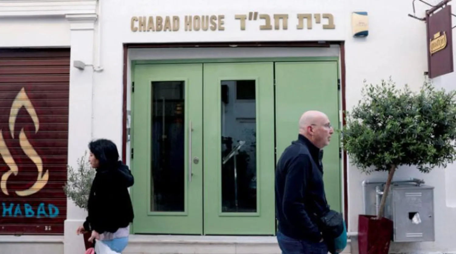 People walking in front of an Israeli restaurant (Reuters)