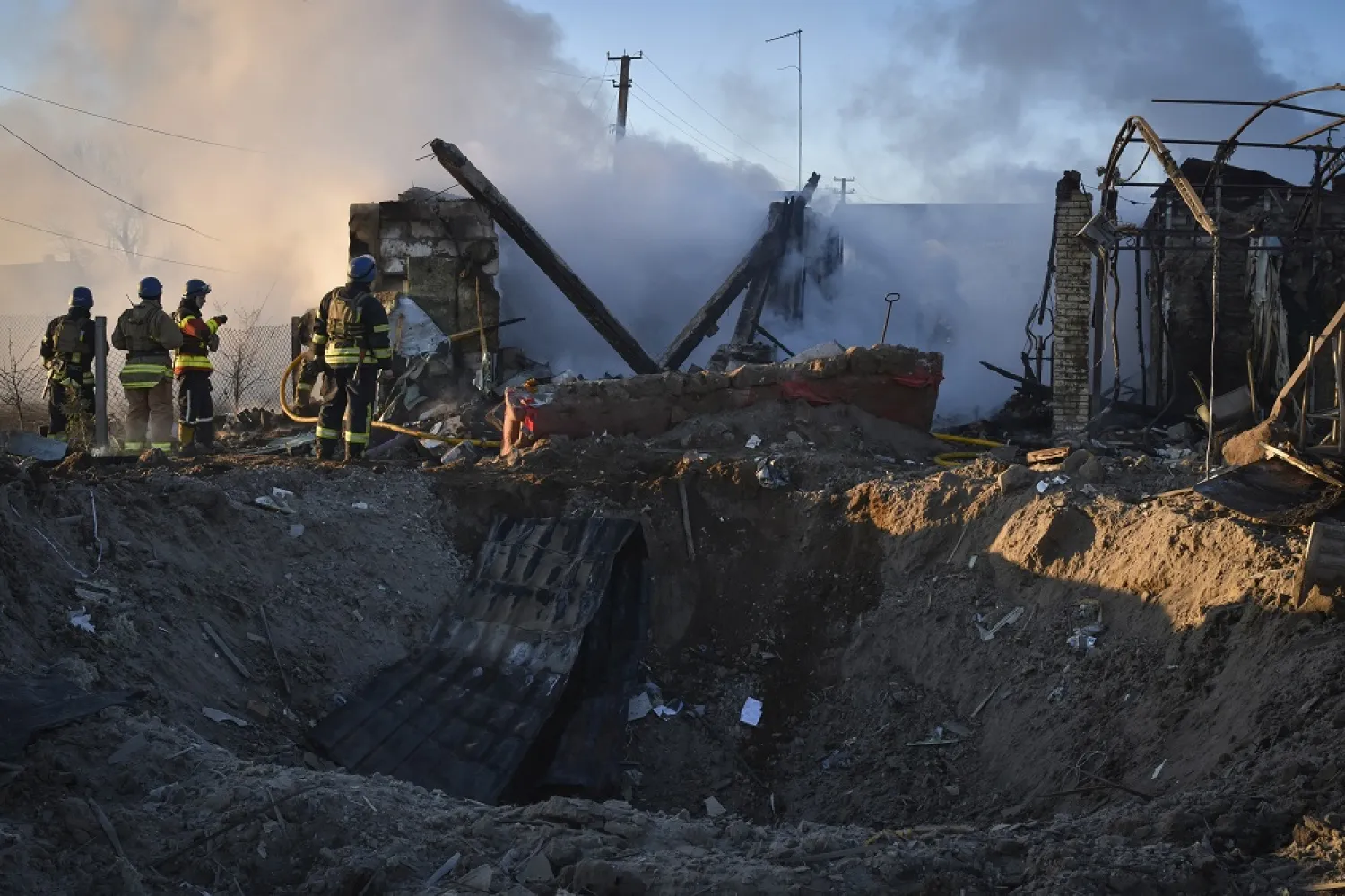 Members of the Ukrainian State Emergency Service clear the rubble at the building which was destroyed as a result of Russian strike in Zaporizhzhia district, Ukraine, Friday, March 31, 2023. (AP)
