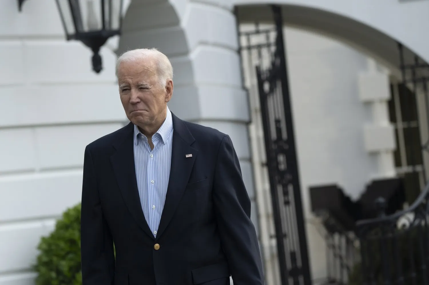 United States President Joe Biden walks towards reporters as he departs the White House to visit tornado damaged parts of the state of Mississippi, in Washington, DC, USA, 31 March 2023. (EPA)