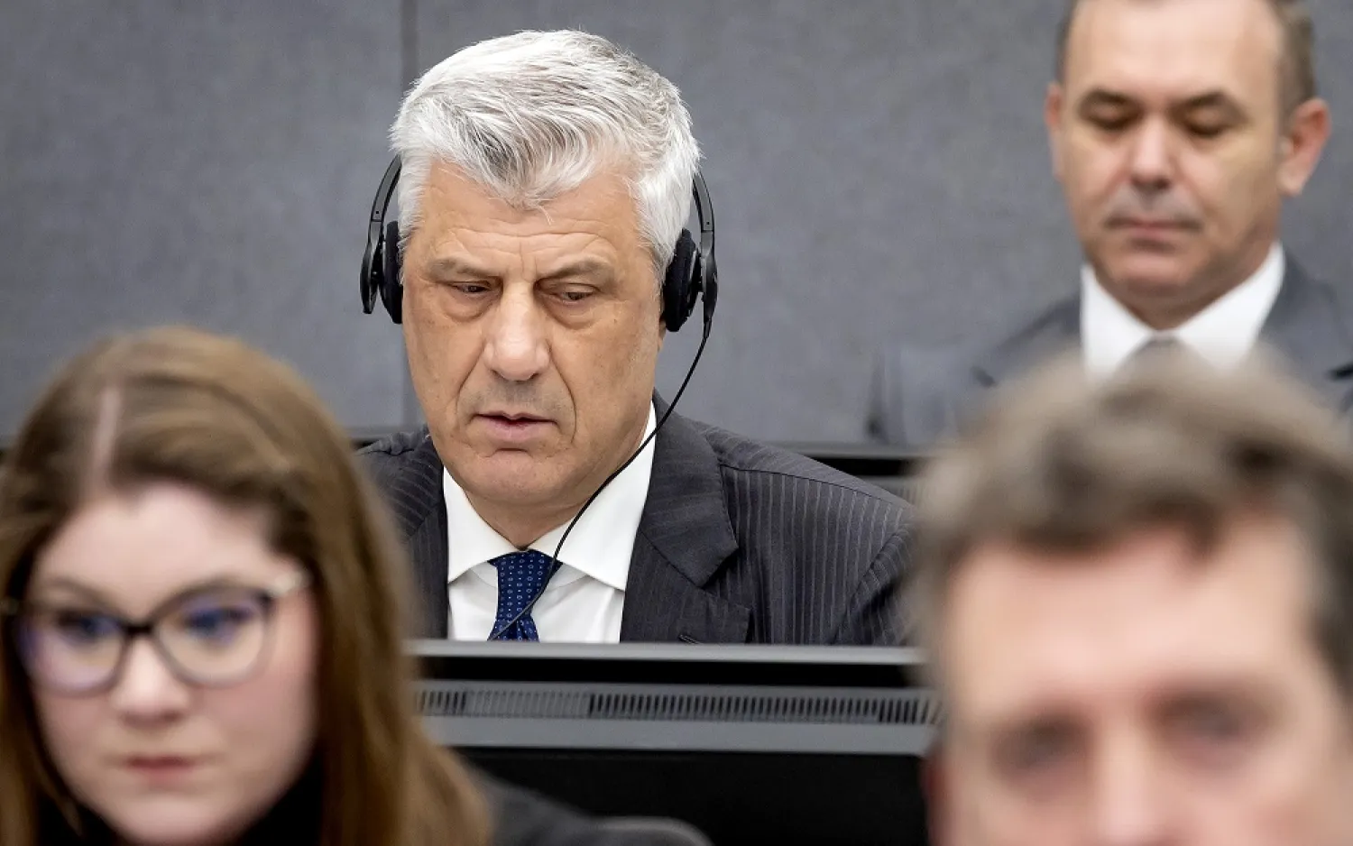 Former Kosovo president Hashim Thaci, left, appears before the Kosovo Tribunal as he defends himself against charges including murder, torture and persecution allegedly committed during his country's war for independence from Serbia in the Hague, Monday, April 3, 2023. (AP)