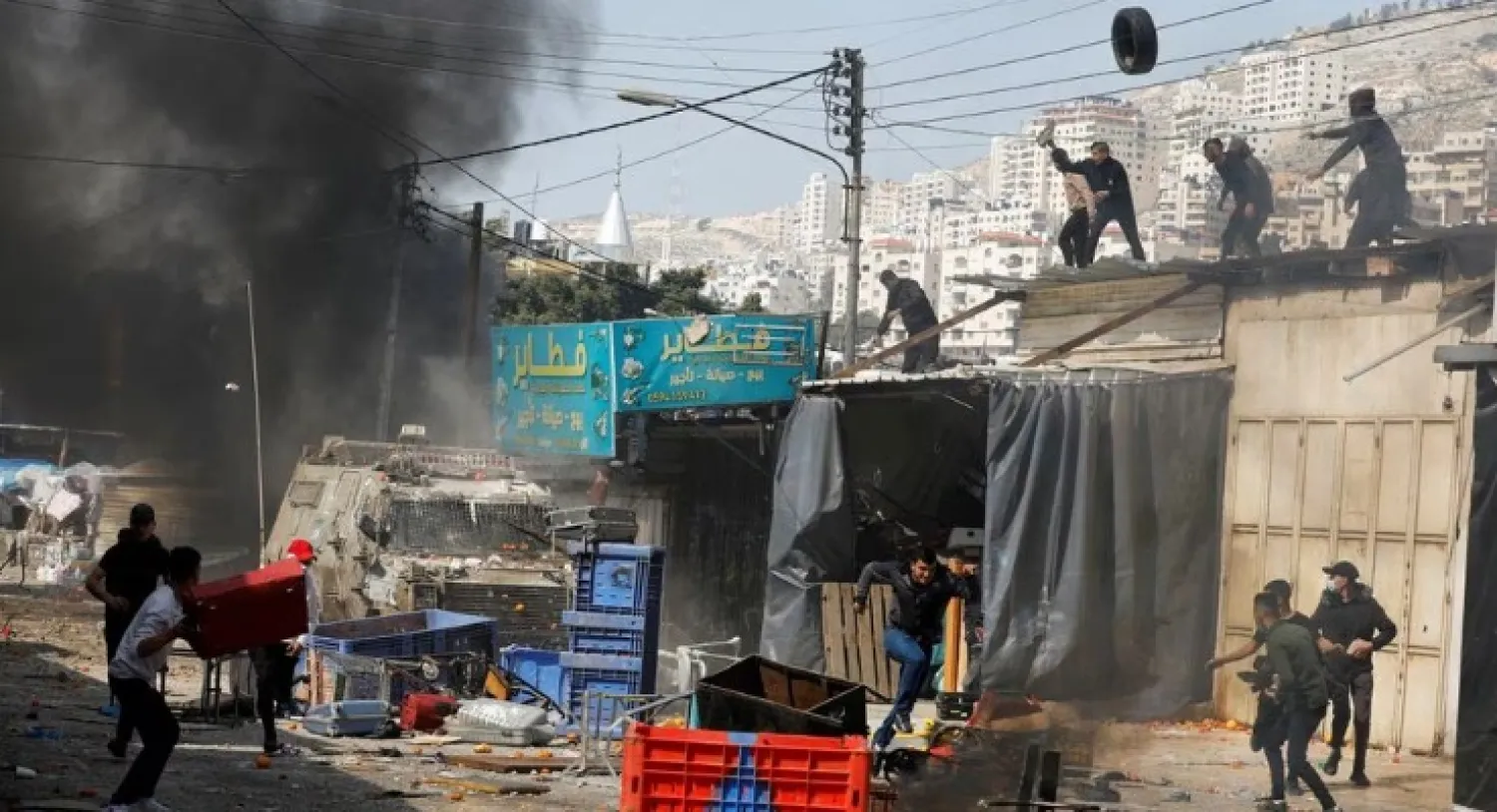 Palestinians clash with Israeli forces during a raid in Nablus in the Israeli-occupied West bank, February 22, 2023. REUTERS/Raneen Sawafta/File Photo