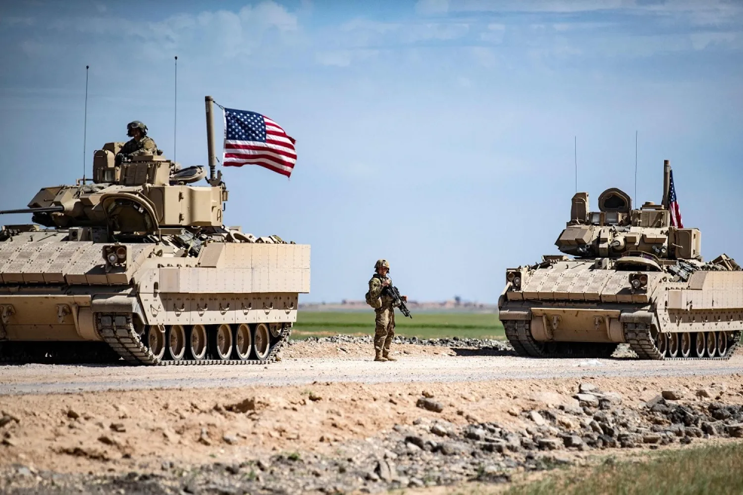US Bradley Fighting Vehicles (BFV) patrol the countryside of the city of Qamishli in Syria's northeastern Hasakeh province, April 20, 2022. (AFP)