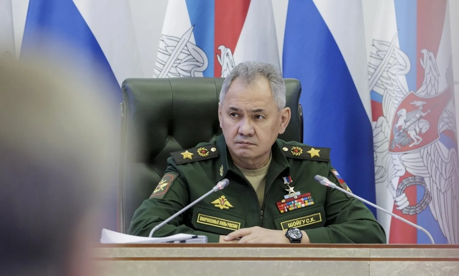 A handout photo made available by the Russian Defense ministry press service shows Russian Defense Minister, General of the Army Sergei Shoigu (C) delivers his speech during a meeting in the National Defense Control Center of the Russian Federation in Moscow, Russia, 22 March 2023. (EPA / Russian Defense Ministry Press Service / Handout)
