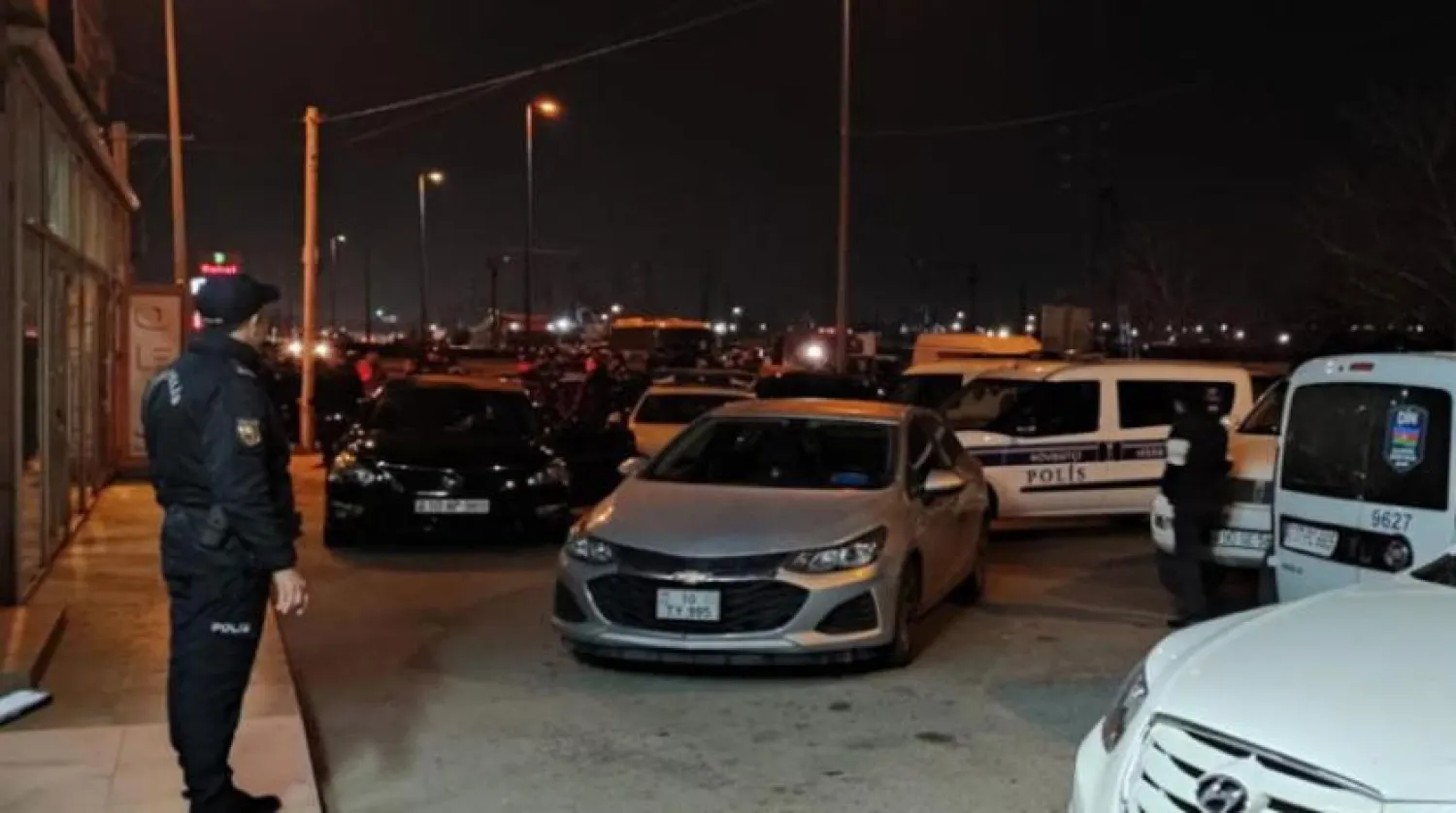 A police officer stands in front of the house of MP Fazil Mustafa in Baku. (EPA Azerbaijan)