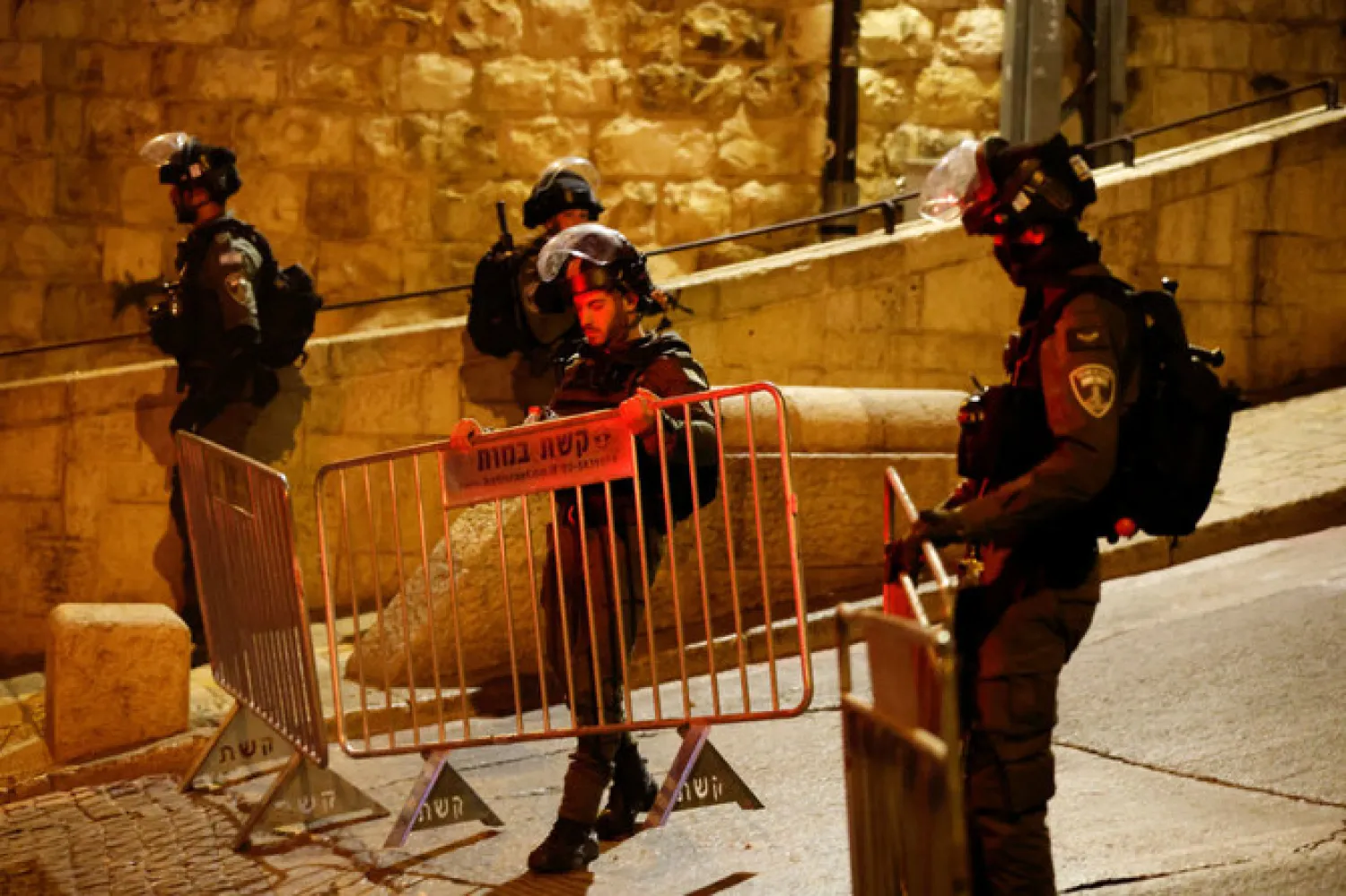 Israeli border policemen set up a fence near Al-Aqsa compound also known to Jews as the Temple Mount, while tension arises during clashes with Palestinians in Jerusalem's Old City, April 5, 2023 - Reuters
