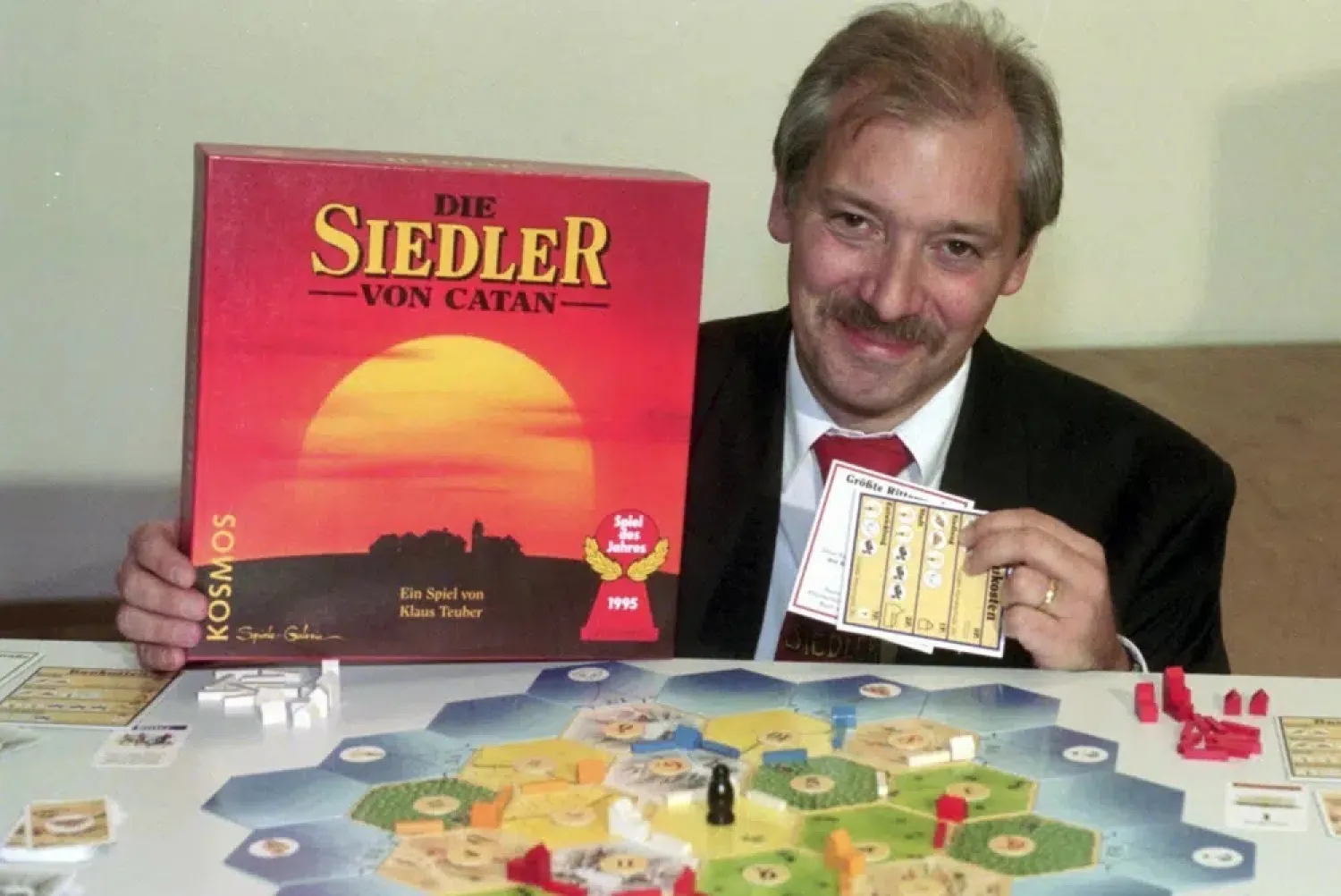 Klaus Teuber, a dental technician from Darmstadt, presents his game "The Settlers of Catan", Friday, Sept. 29, 1995, in Frankfurt, Germany. (AP)