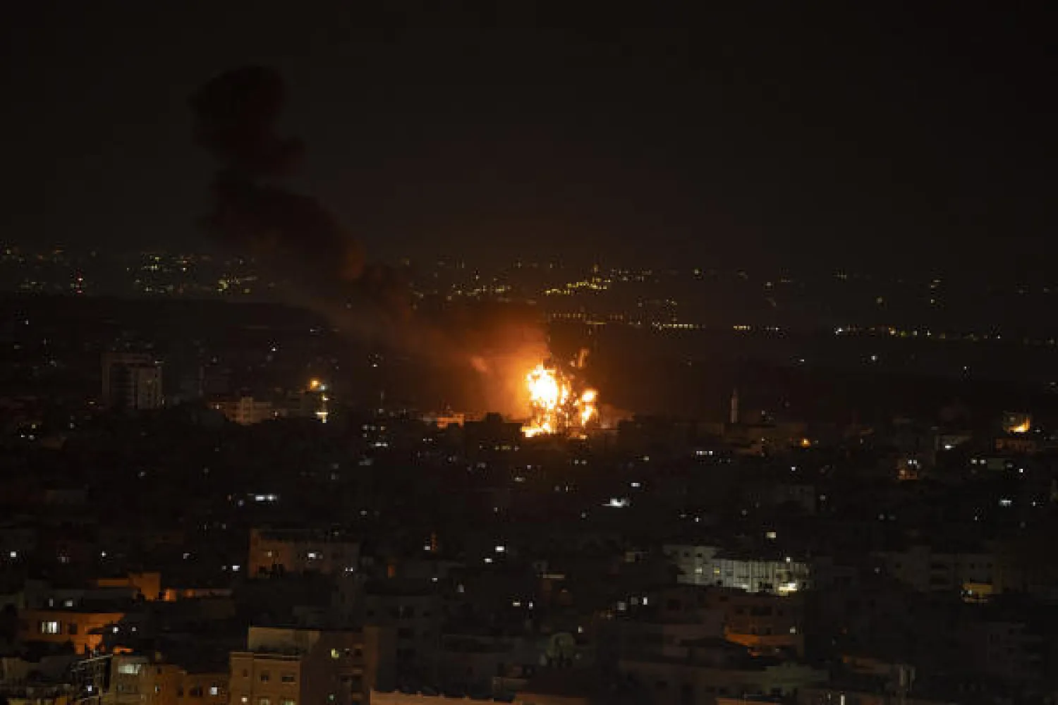 Fire and smoke rise following an Israeli airstrike in central Gaza Strip, Friday, April 7, 2023. (AP Photo/Fatima Shbair)
