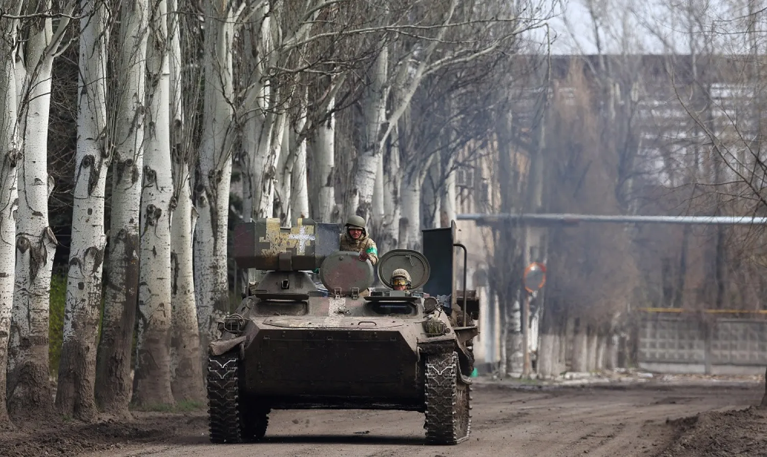 An armored military vehicle speeds through Chasiv Yar during heavy fighting at the fronttline of Bakhmut and Chasiv Yar, Ukraine, April 9, 2023. (Reuters)