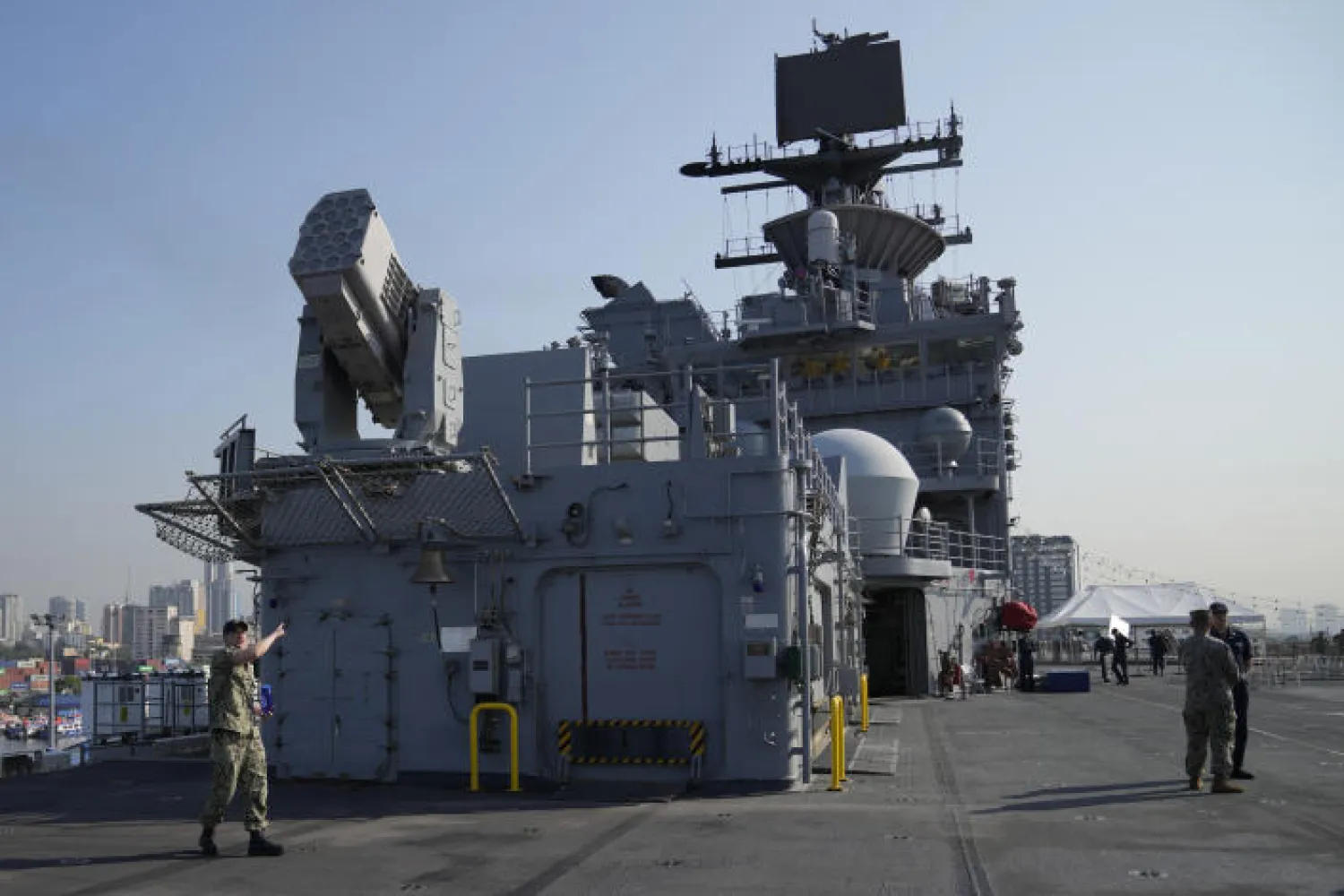 A US Marines personnel gestures at the flight deck of the USS America (LHA 6) during a scheduled port visit in Manila, Philippines on Tuesday, March 21, 2023.(AP Photo/Aaron Favila)
