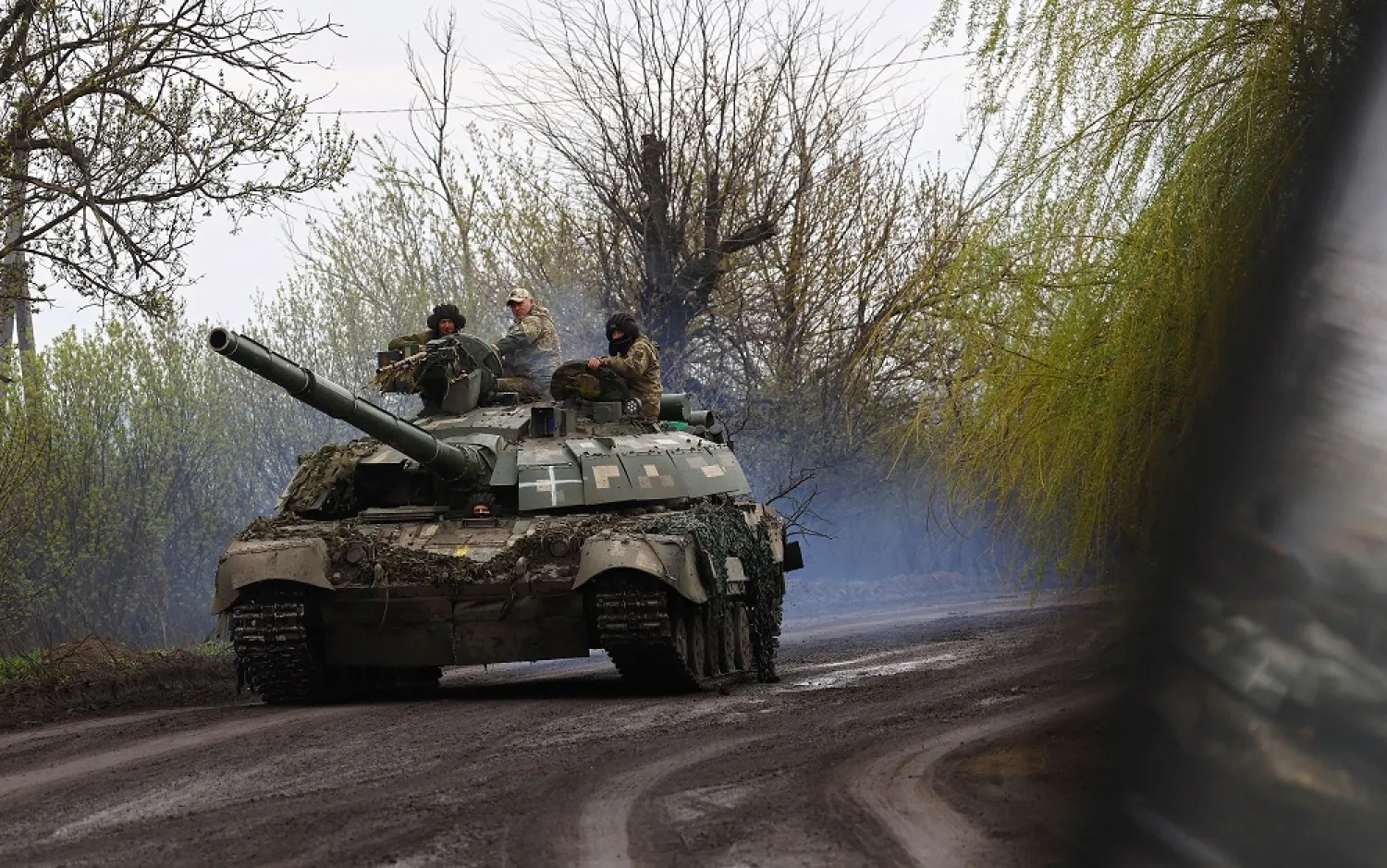 Ukrainian servicemen drive towards the frontline during heavy fighting at the frontline of Bakhmut and Chasiv Yar, in Chasiv Yar, Ukraine, April 12, 2023. (Reuters)