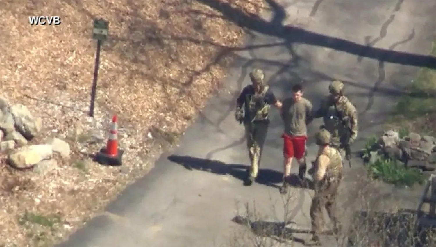 FBI agents arrest intelligence leak suspect Jack Teixeira outside a residence in this still image taken from video in North Dighton, Massachusetts, on April 13, 2023.(WCVB-TV via ABC via REUTERS)
