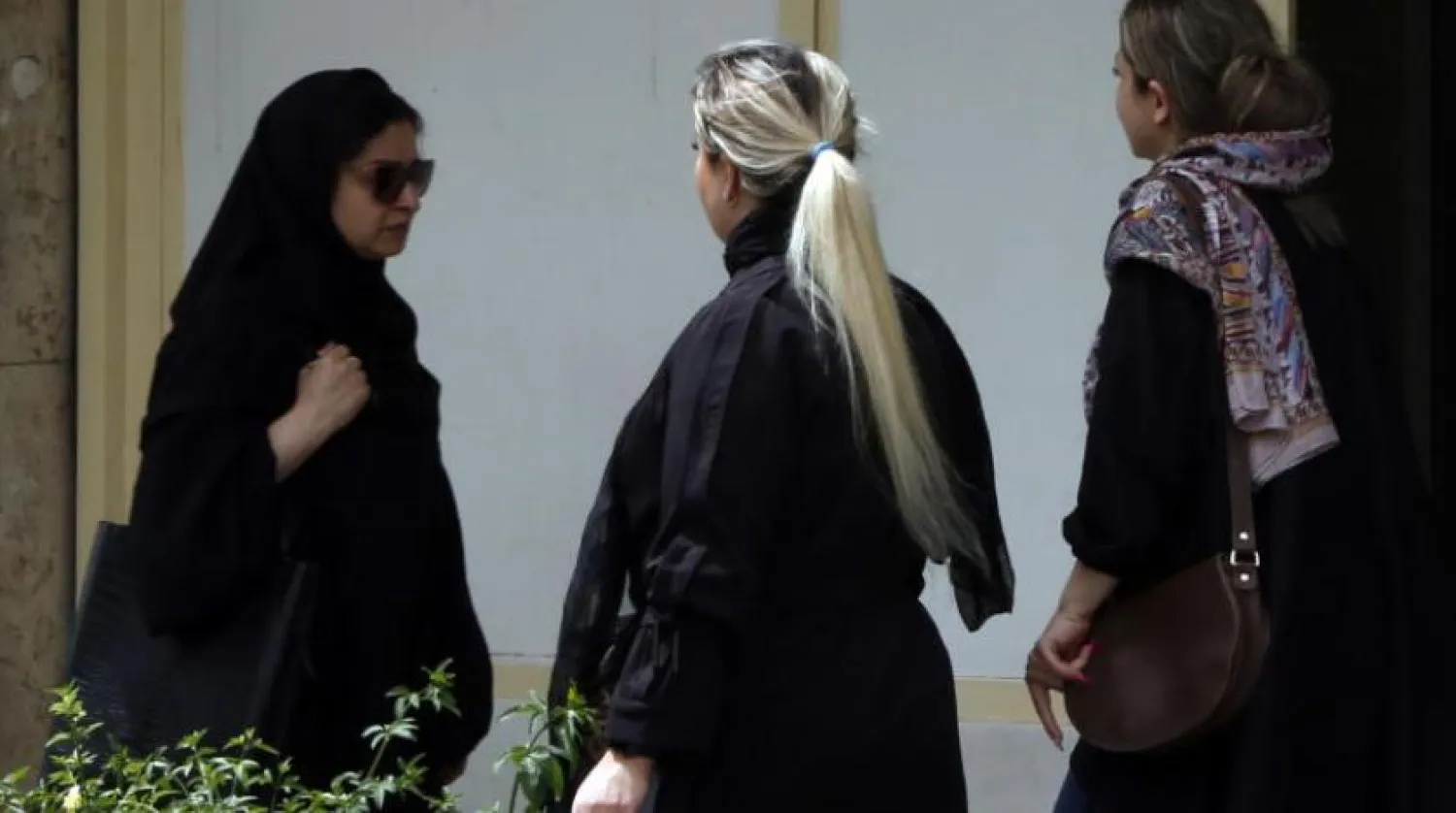 Iranian women walk in the street without wearing a headscarf, in Tehran, Iran, 10 April 2023. EPA/ABEDIN TAHERKENAREH