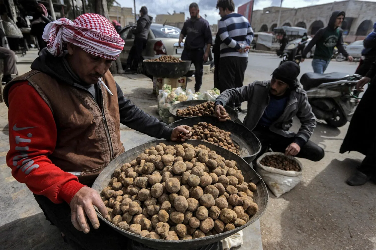 In this file photo merchants present their desert truffles at a market in the city of Hama in west-central Syria on March 6, 2023. (AFP)