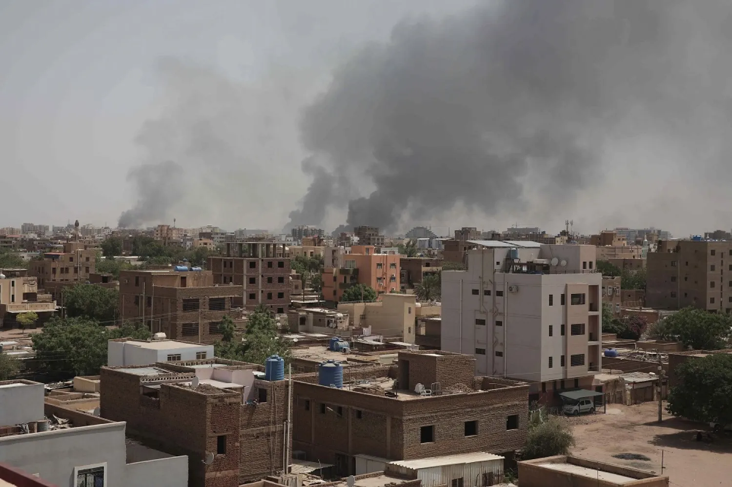 Smoke rises from a central neighborhood of Khartoum, Sudan, Sunday, April 16, 2023, after dozens have been killed in two days of intense fighting. (AP)
