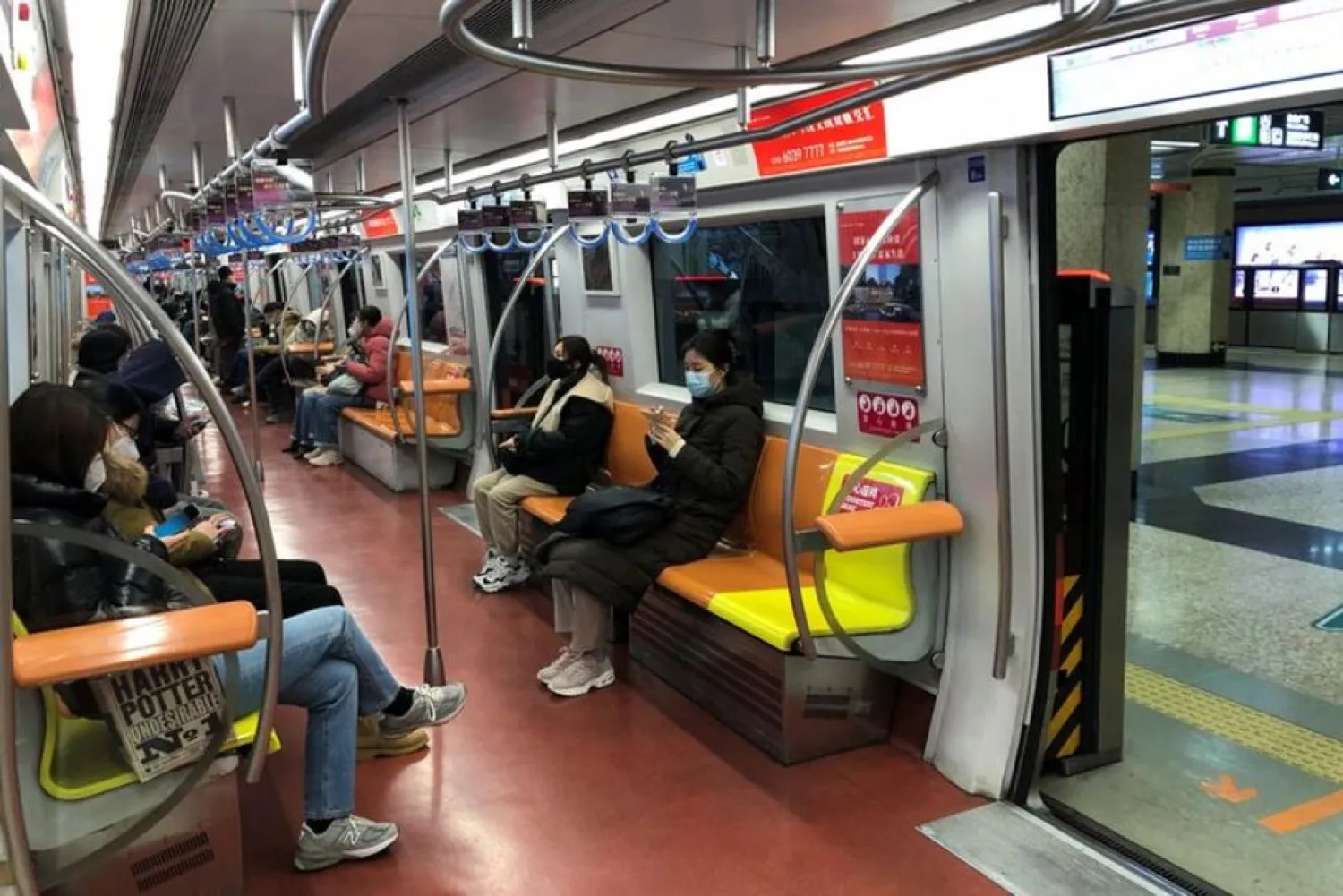 People ride on a subway during evening rush hour, after the government loosened coronavirus disease (COVID-19) restrictions, in Beijing, China December 9, 2022. (Reuters)