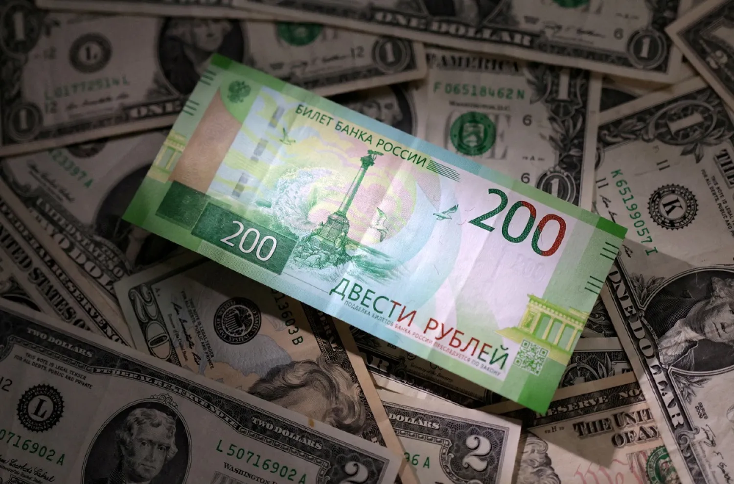 Russian rouble and US dollar banknotes are seen in this illustration taken March 10, 2023. (Reuters)