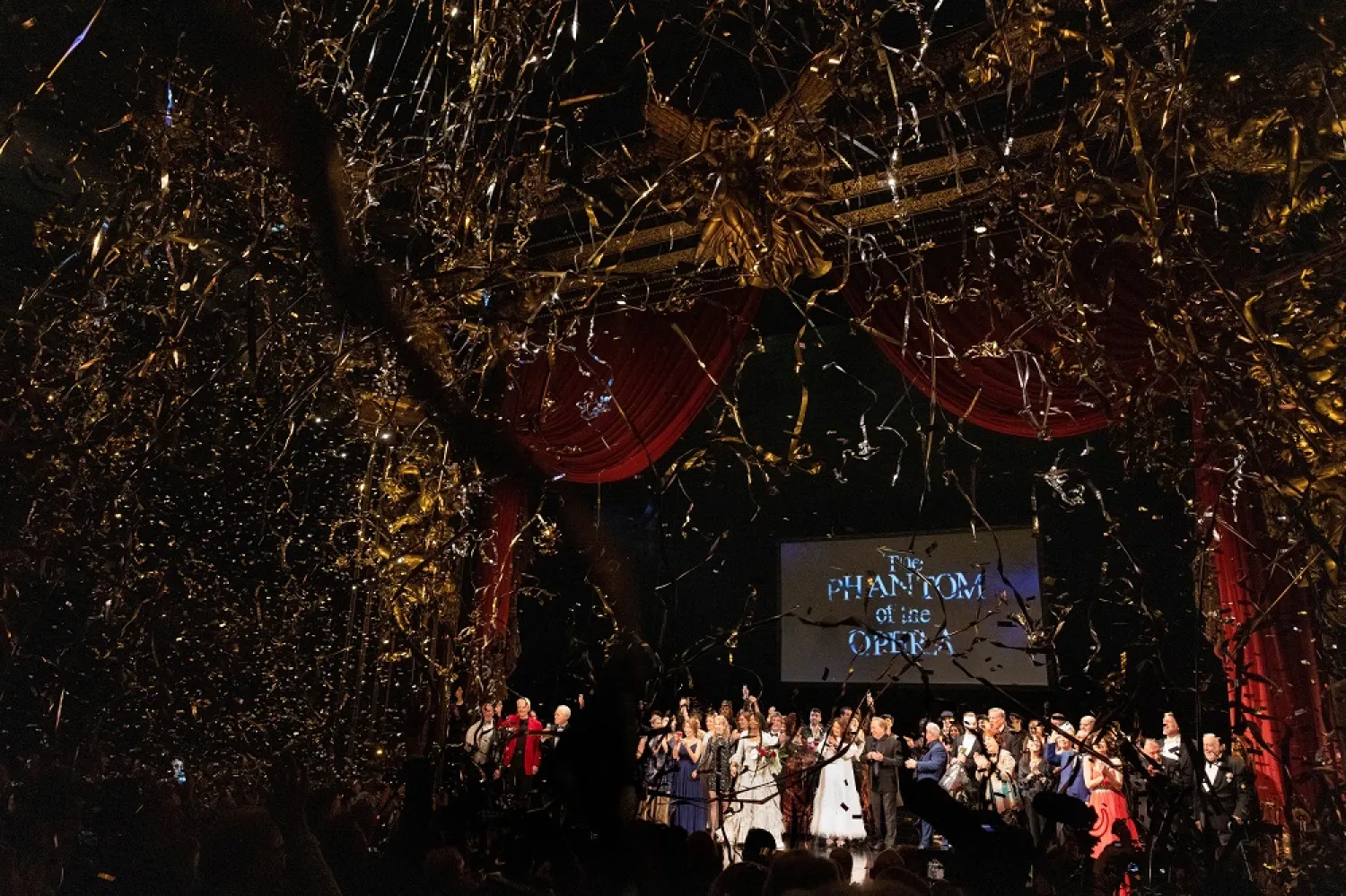Cast and crew members take a final bow as confetti is released after the final performance of the Phantom of the Opera, which closes after 35 years on Broadway, in New York City, US, April 16, 2023. (Reuters)