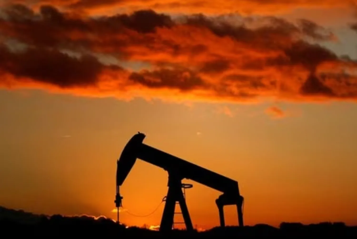 A oil pump is seen at sunset outside Scheibenhard, near Strasbourg, France, October 6, 2017. REUTERS/Christian Hartmann/File Photo