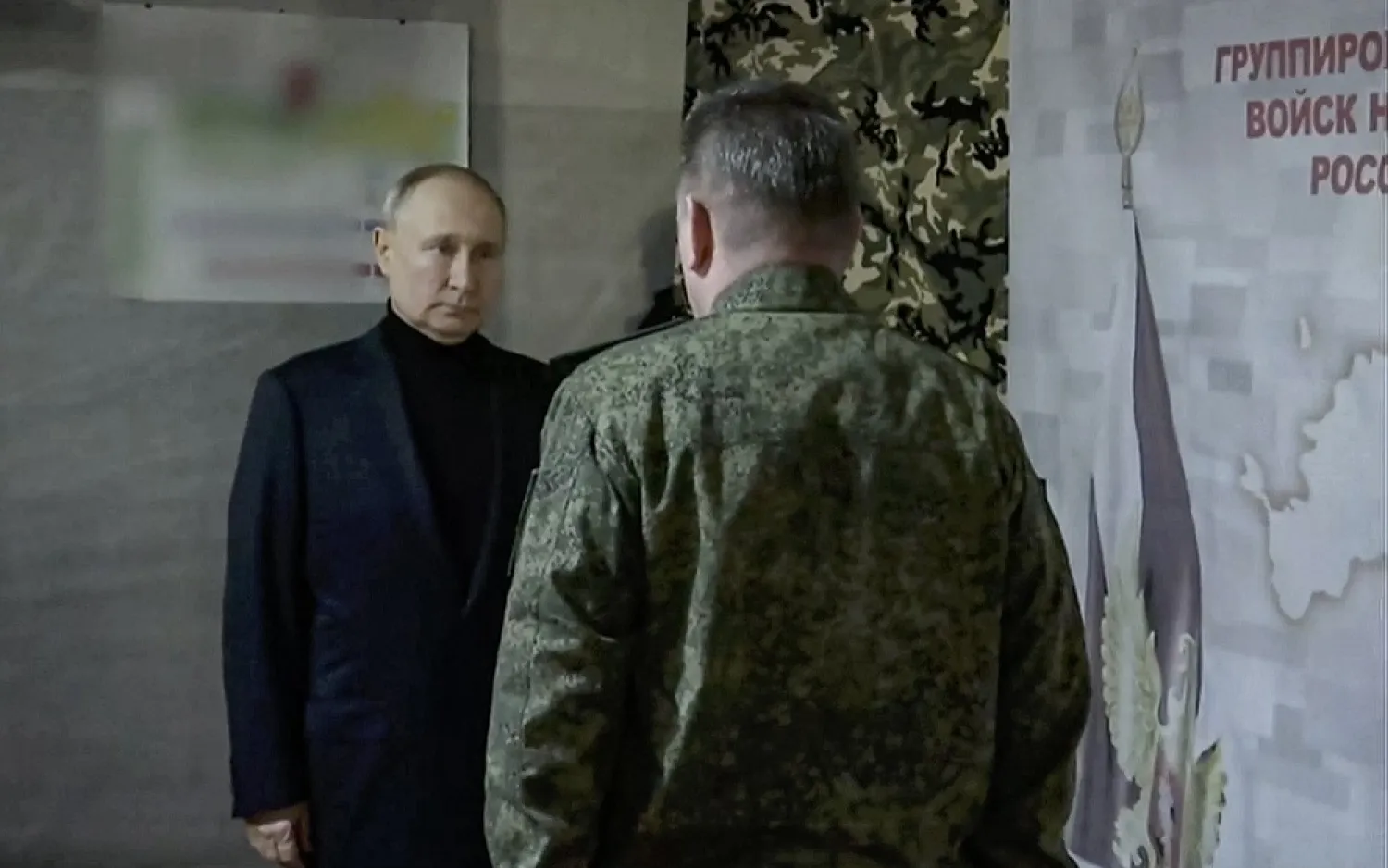 A handout still image taken from handout video provided by Kremlin.ru shows Russian President Vladimir Putin (L) visiting the headquarters of the Vostok National Guard in the Luhansk People's Republic, 18 April 2023. (EPA/Kremlin.ru/Handout)