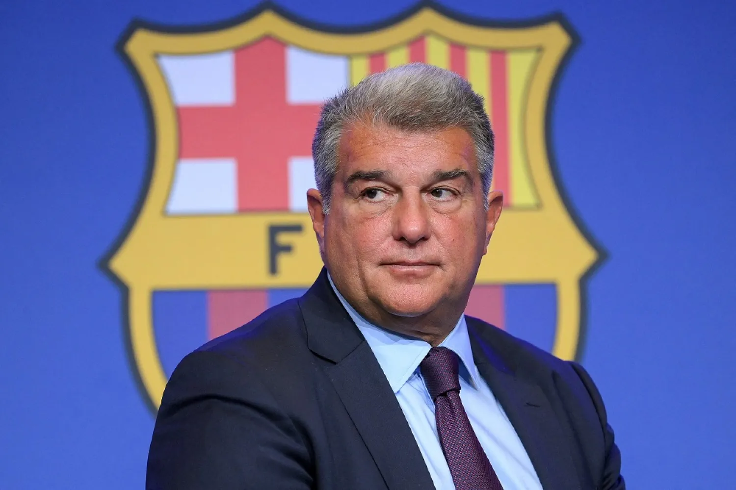 Barcelona's President Joan Laporta presents documents as he addresses a press conference at the Camp Nou stadium in Barcelona on April 17, 2023. (AFP)