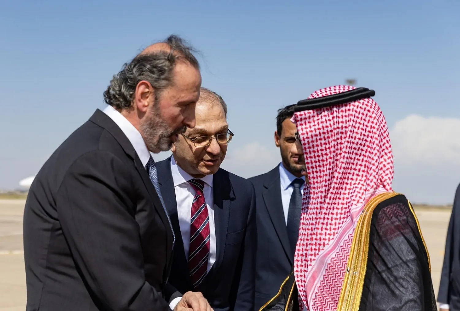 18 April 2023, Syria, Damascus: Minister of Presidential Affairs of Syria Mansour Azzam (L) welcomes Saudi Foreign Minister Faisal bin Farhan bin Abdullah at Damascus airport. (SPA)