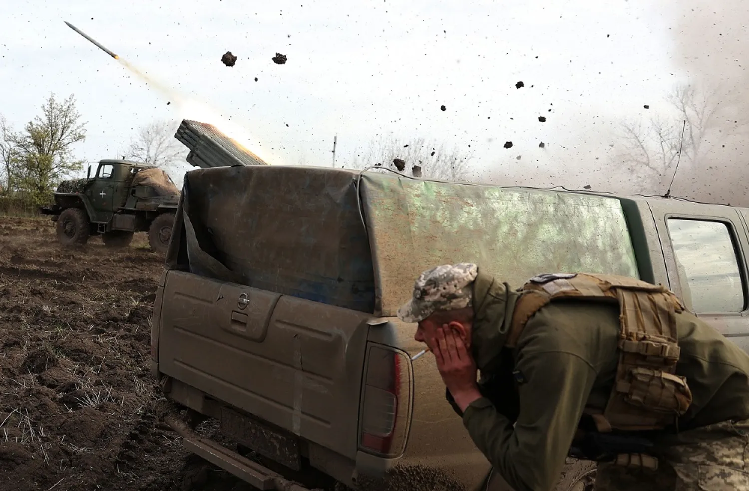 Artillerymen of the Ukrainian 80th separate airborne assault brigade fire from a BM-21 Grad multiple rocket launcher towards Russian positions on the front line near Bakhmut in the Donetsk region, on April 18, 2023, amid the Russian invasion of Ukraine. (AFP)