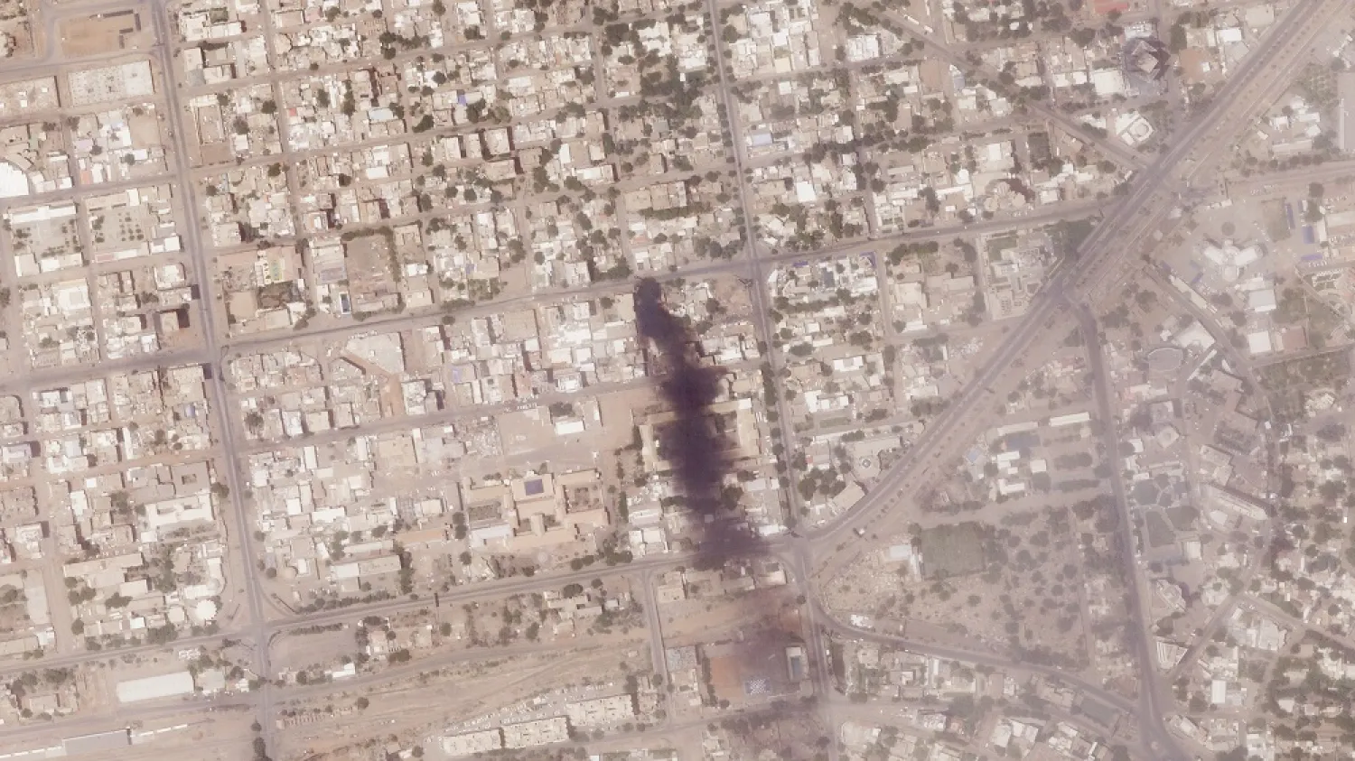 This satellite photo from Planet Labs PBC shows a fire near several hospitals in Khartoum, Sudan, Tuesday, April 18, 2023. (Planet Labs PBC via AP)