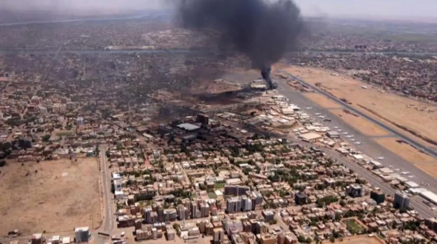 This image grab taken from AFPTV video footage on April 20, 2023, shows an aerial view of black smoke rising above the Khartoum International Airport amid ongoing battles between the forces of two rival generals. (Photo by AFP)
