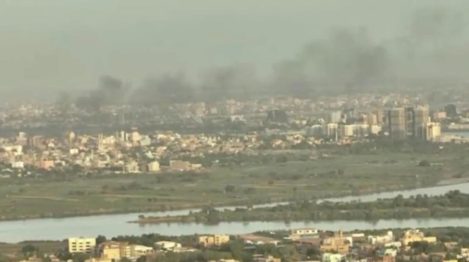 A drone view shows smoke rising over buildings a week after fighting began in North Khartoum, as seen from Omdurman, Sudan, April 22, 2023, in this still image taken from video obtained by Reuters. Reuters TV via REUTERS
