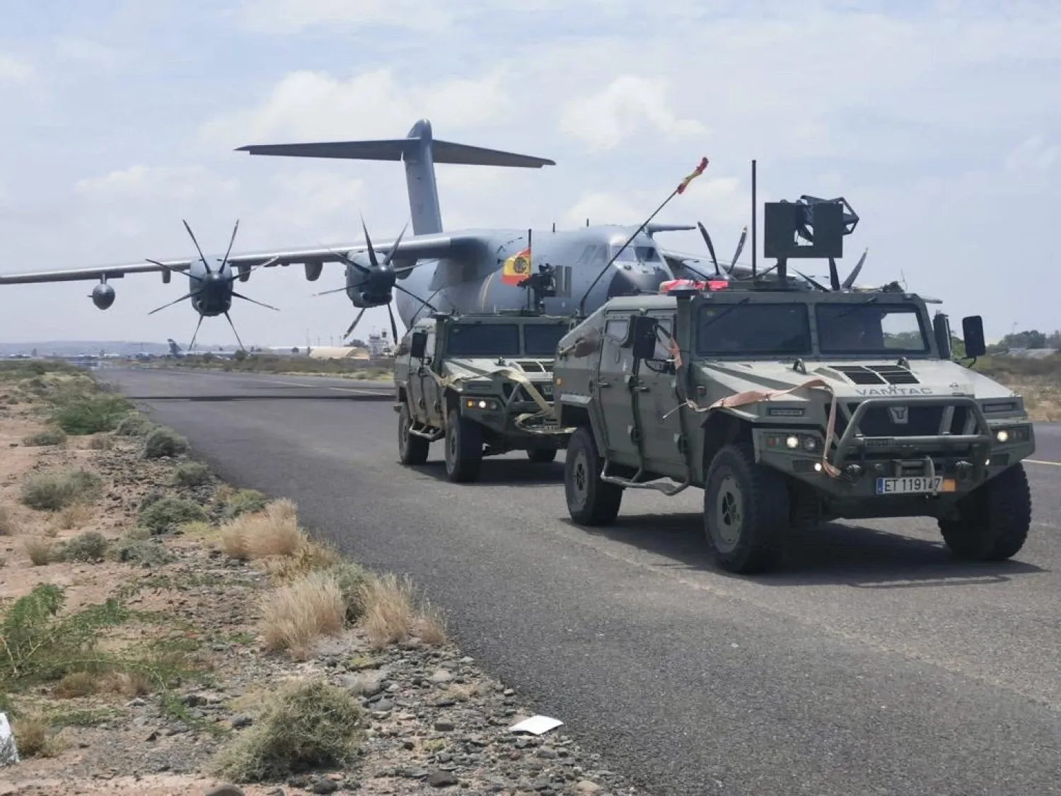 Spanish military plane and military vehicles are seen departing on tarmac as Spanish diplomatic personnel and citizens are evacuated, in Khartoum, Sudan, April 23, 2023. (Spanish Defense Ministry Handout/Handout via Reuters)