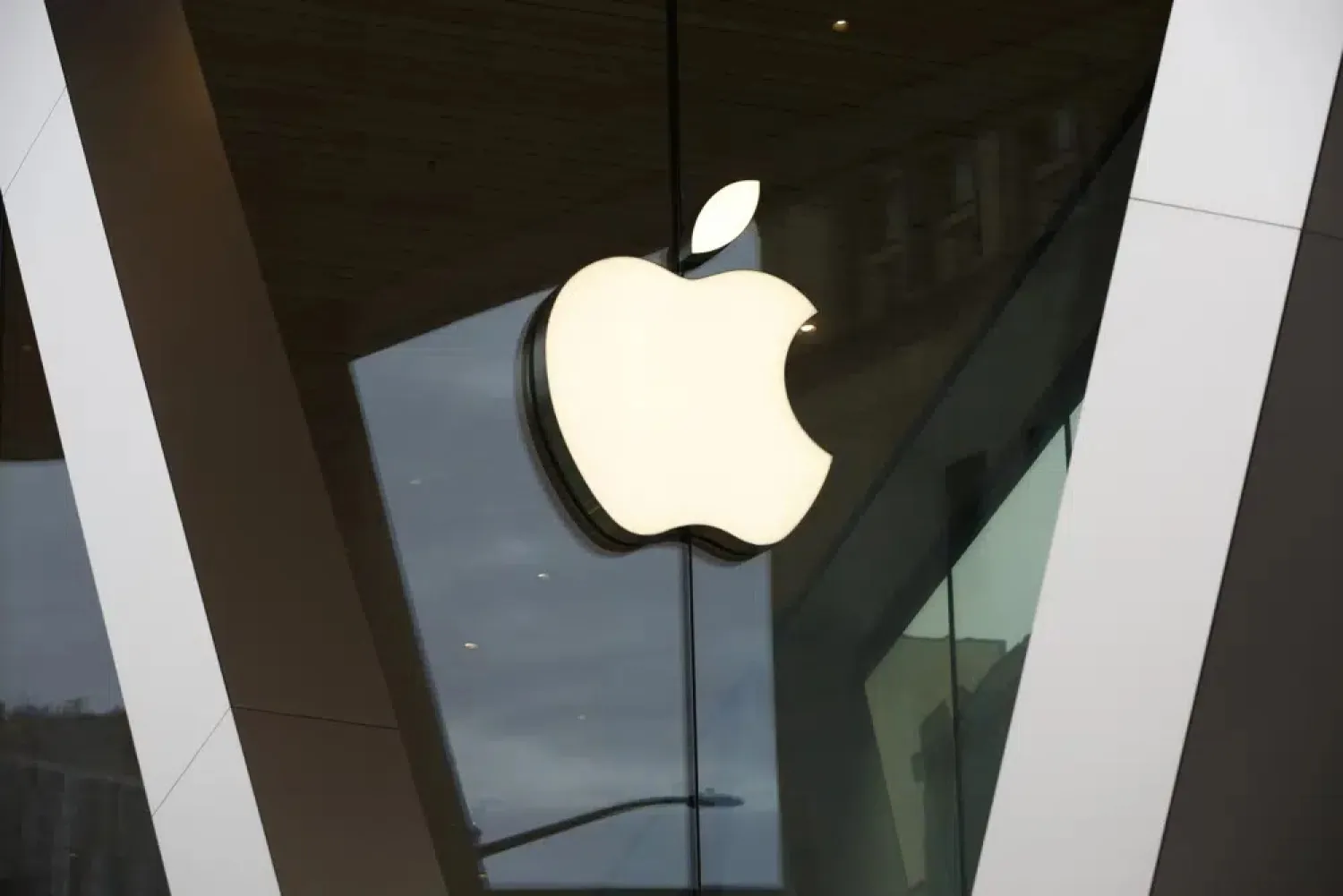 FILE - An Apple logo adorns the façade of the downtown Brooklyn Apple store on March 14, 2020, in New York. (AP Photo/Kathy Willens, File)
