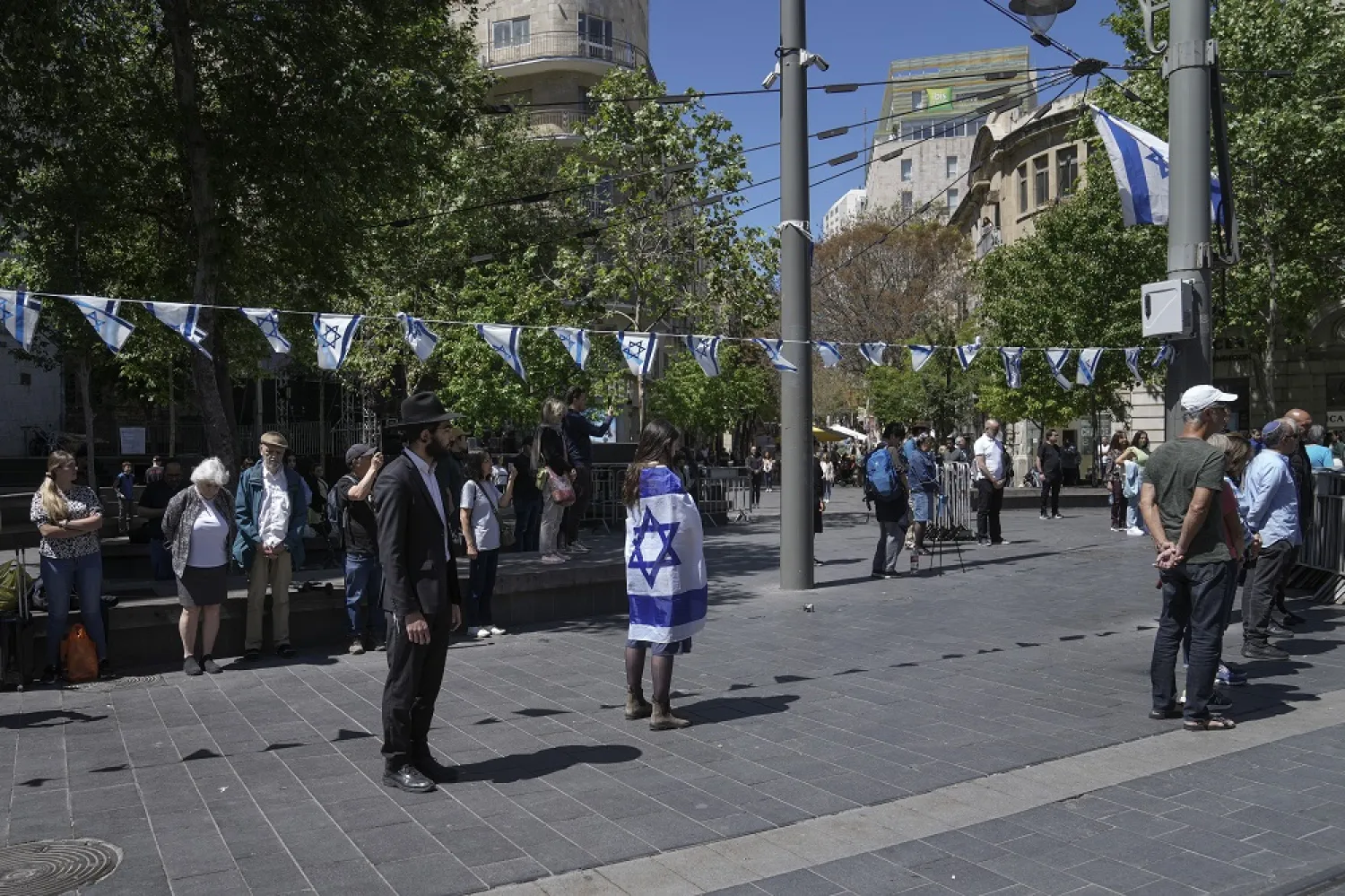 Israelis stand still to observe two minutes of silence as air raid sirens sound to mark Israel's annual Memorial Day for fallen soldiers, in Jerusalem, Tuesday, April 25, 2023. (AP)
