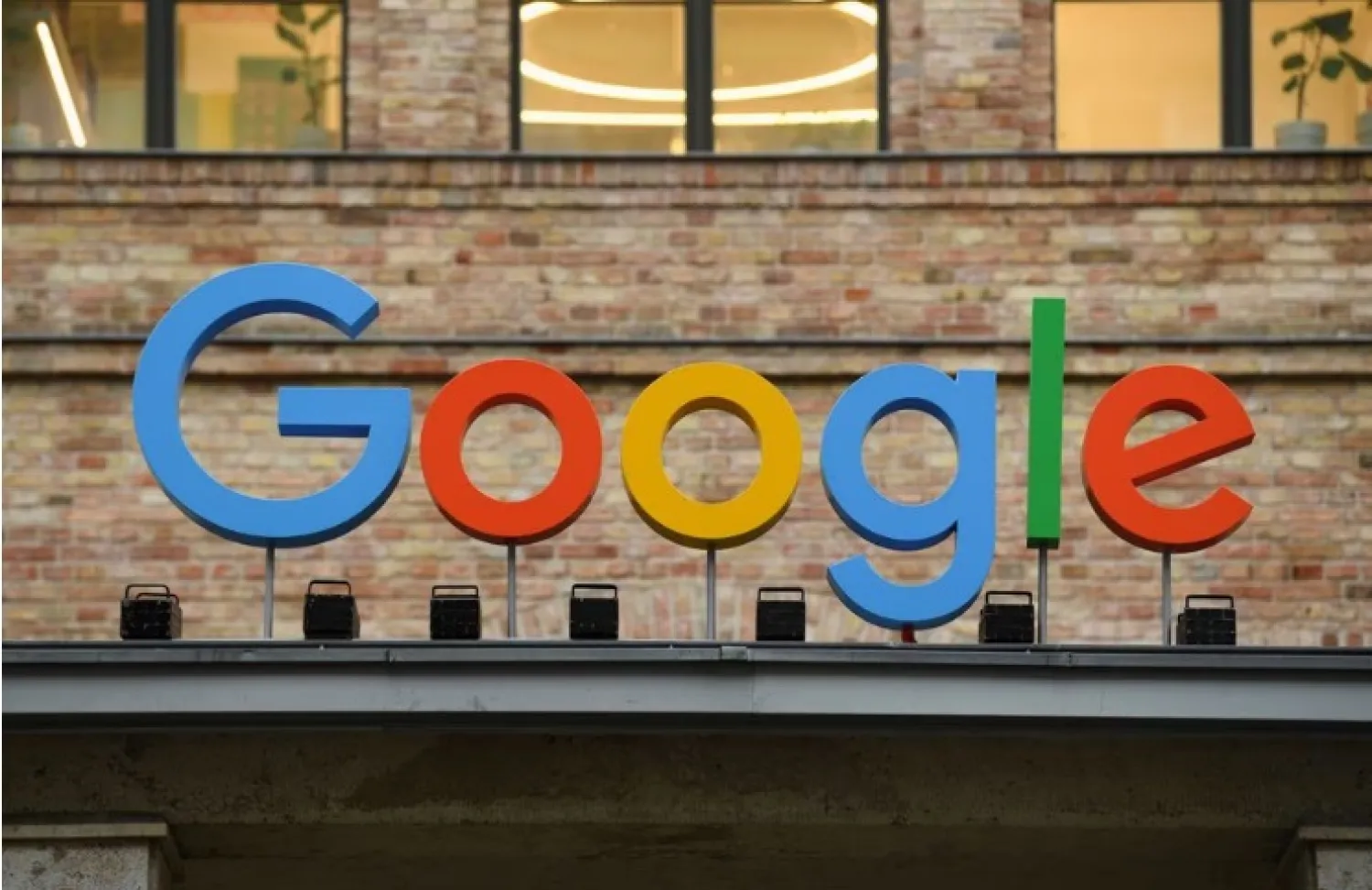 A view of a sign above the entrance of the Google office in Berlin, Germany, August 31, 2021. REUTERS/Annegret Hilse
