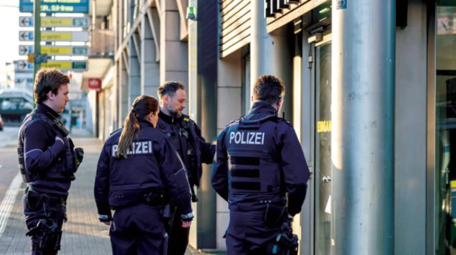 Police in front of the gym in Duisburg, on Tuesday, after an attack that seriously injured four people (dpa)

