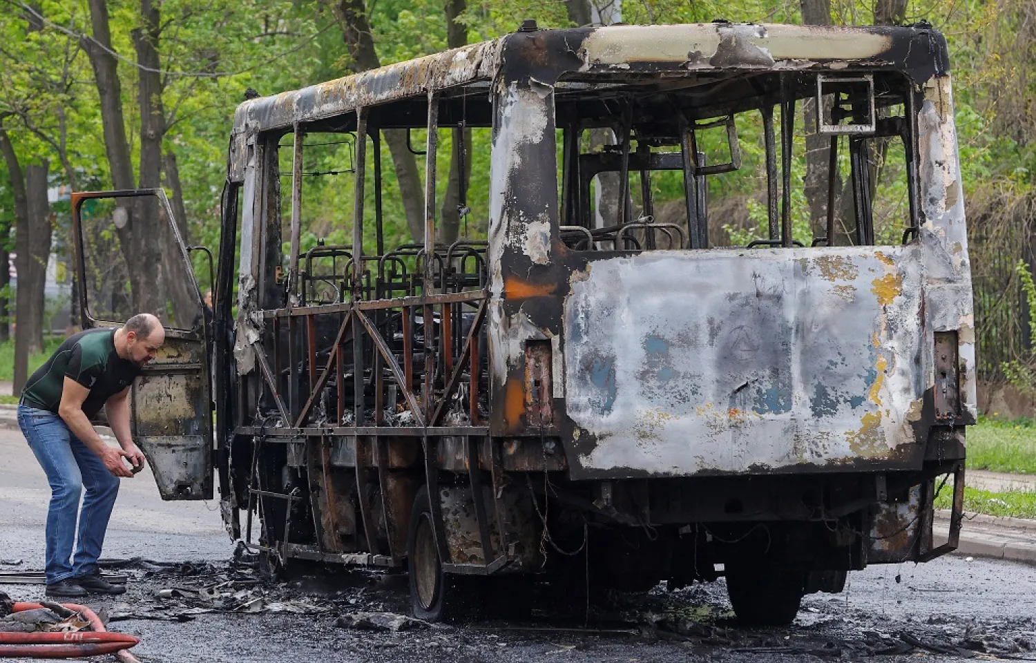  A view shows a burnt-out minibus hit by shelling in the course of Russia-Ukraine conflict in Donetsk, Russian-controlled Ukraine, April 28, 2023. (Reuters)