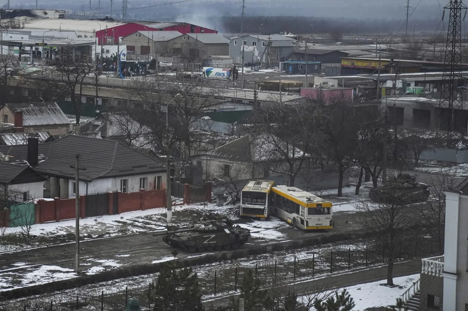 Russian army tanks move through a street on the outskirts of Mariupol, Ukraine, March 11, 2022. (AP)