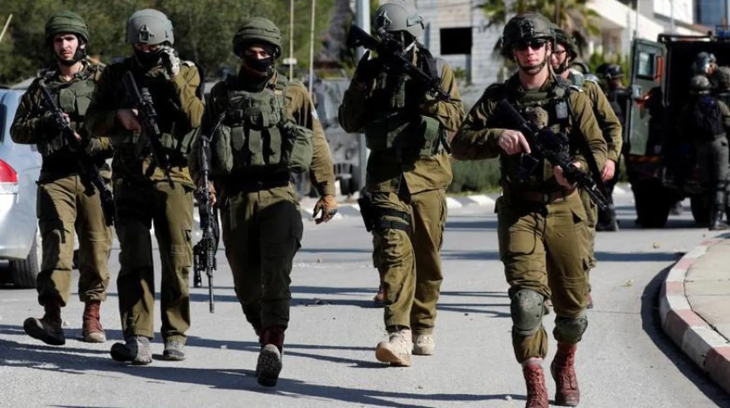 File photo: Israeli soldiers walk during clashes with Palestinians in Ramallah in the occupied West Bank December 10, 2018. REUTERS/Mohamad Torokman

