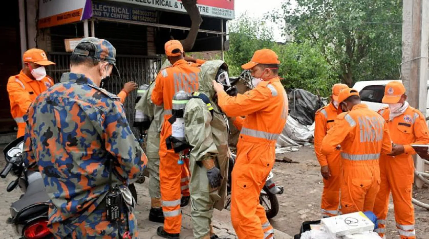 Members of National Disaster Response Force (NDRF) wear protective gear at the site of a gas leak in Ludhiana in the northern state of Punjab, India, April 30, 2023. REUTERS/Stringer 