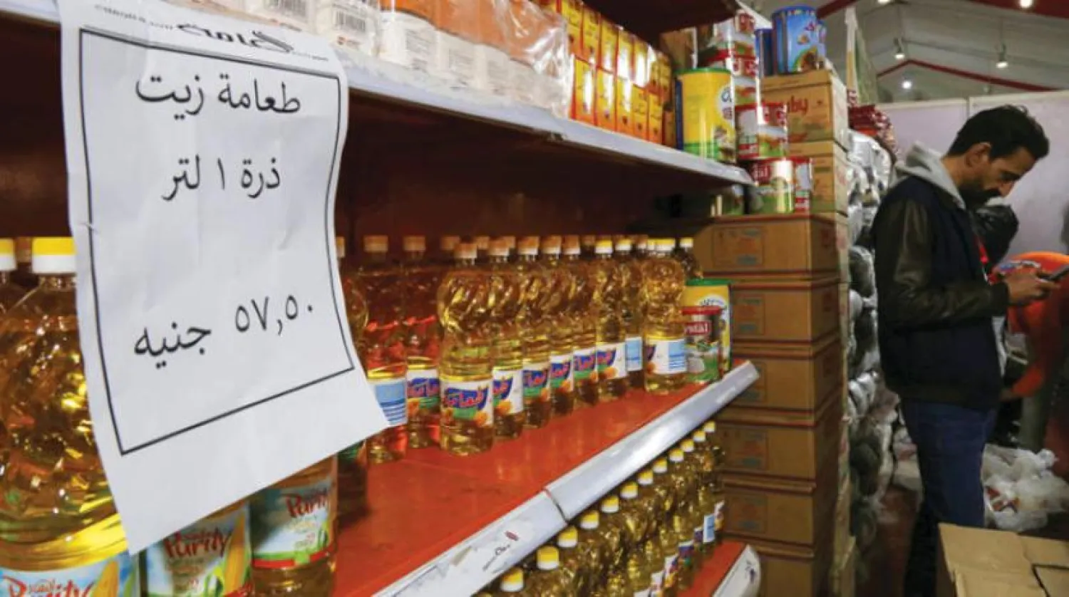 Butter, oil, and flour on the shelves in a grocery store in Cairo, Egypt (Reuters)