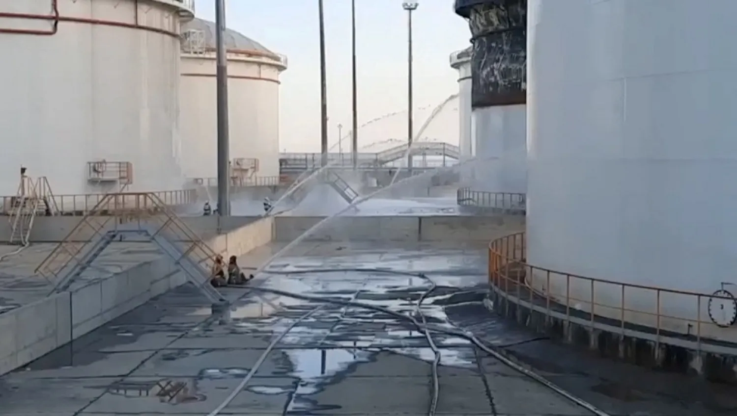 Members of Russian emergencies ministry work to put out a fire at a fuel depot in the village of Volna in the Krasnodar region, Russia, May 3, 2023. (Governor of Krasnodar Region Veniamin Kondratyev via Telegram/Handout via Reuters)