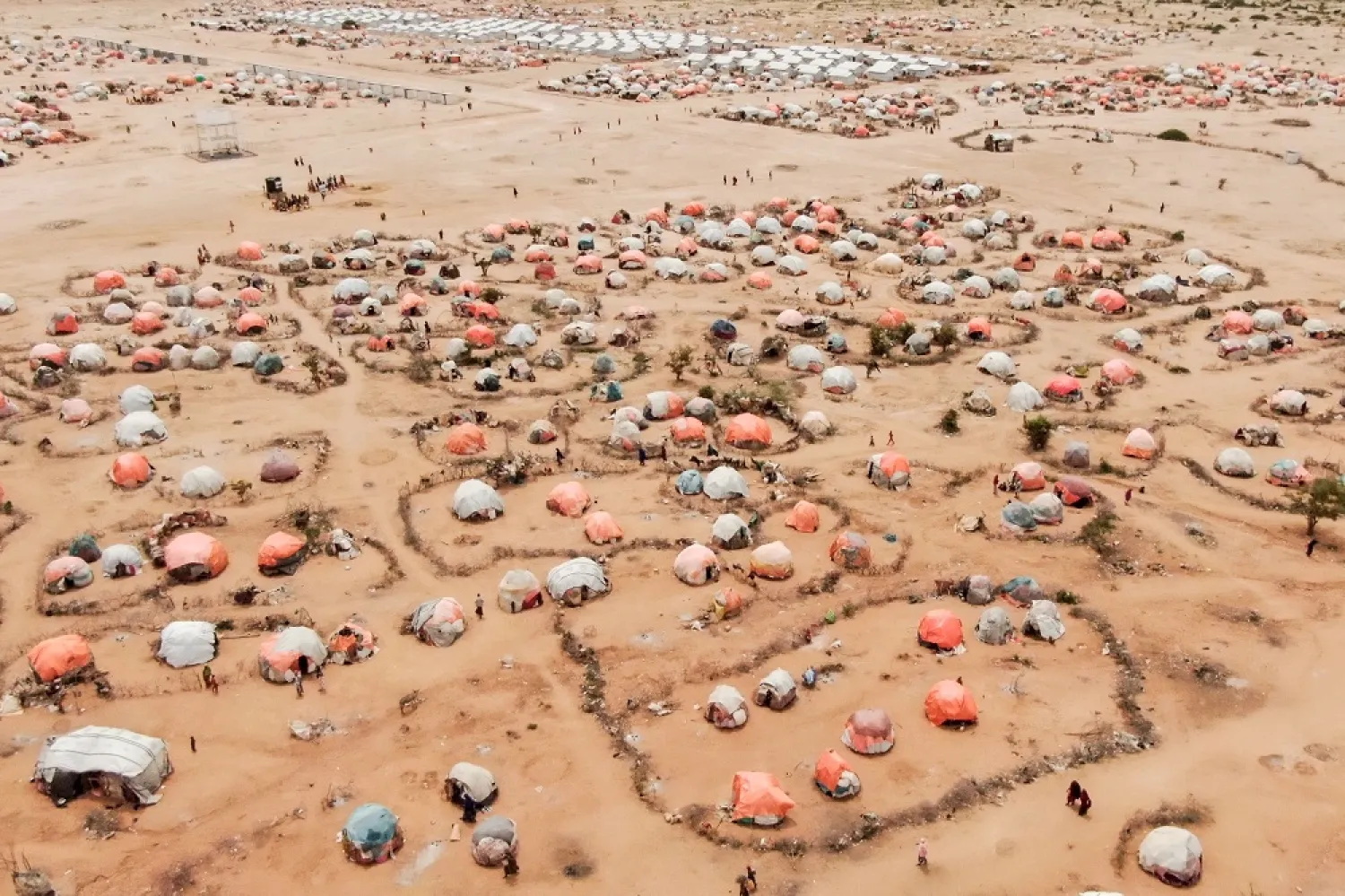 This aerial view shows makeshift structures of people displaced by drought at the Ladan internally displaced people (IDP) camp in Dolow on May 1, 2023. (AFP)
