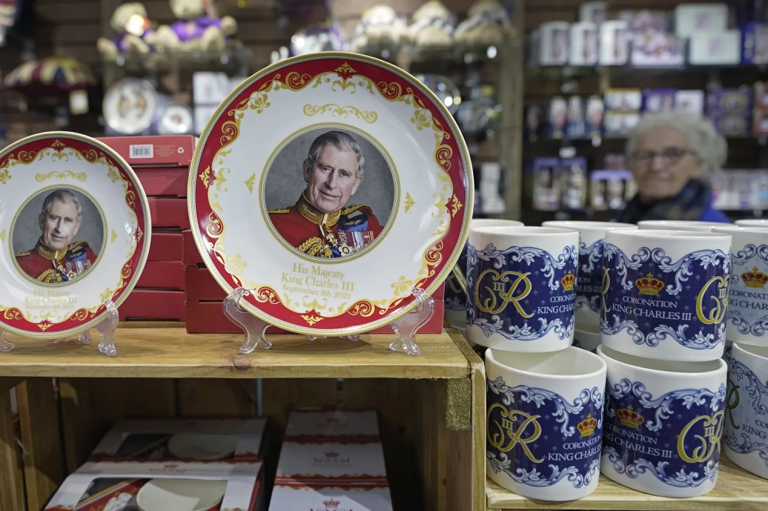 Coronation plates and mugs are displayed for sale in a gift shop in London, Monday, April 24, 2023. (AP)