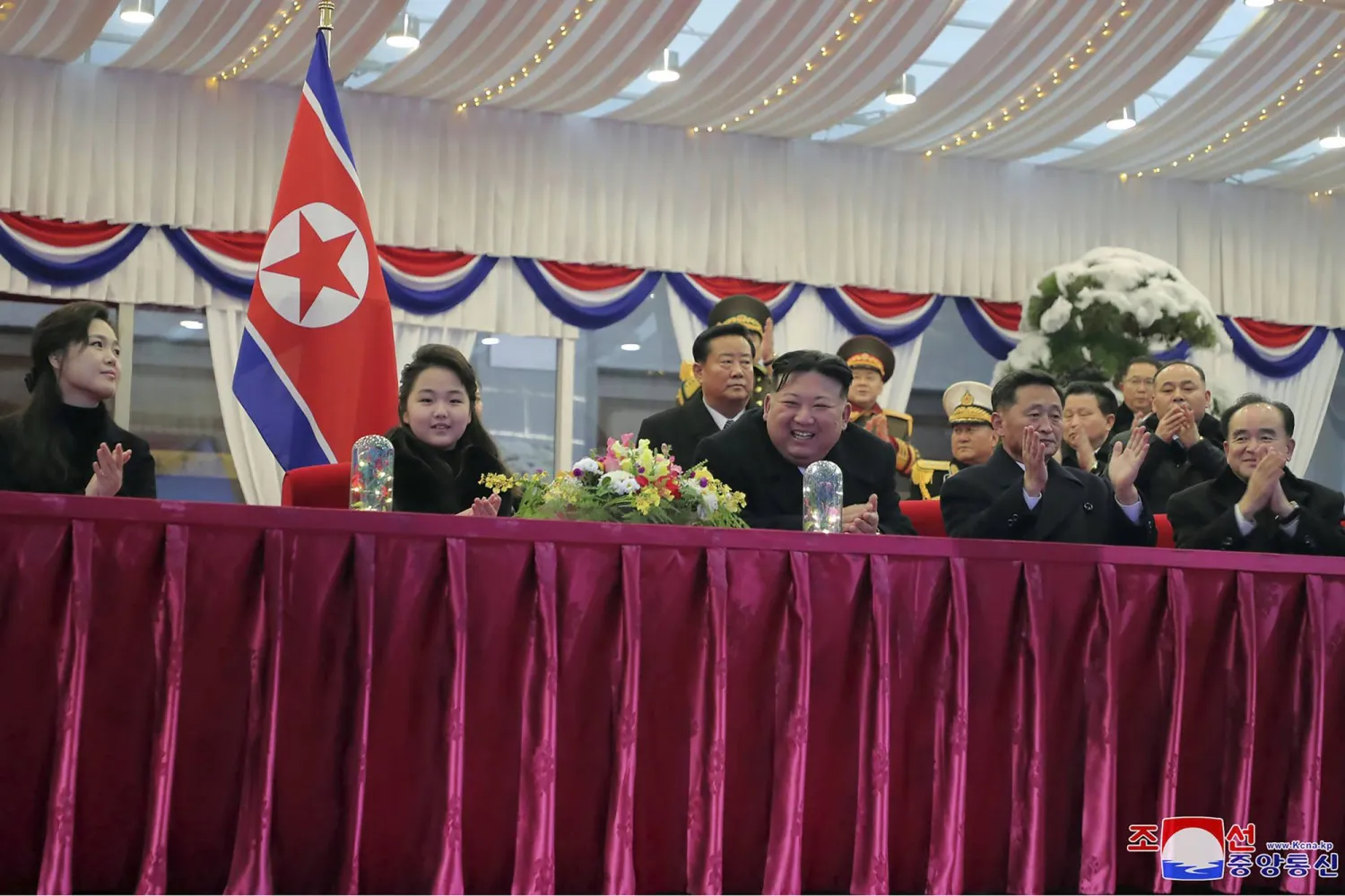 In this photo provided by the North Korean government, North Korean leader Kim Jong Un, center, with his daughter and his wife Ri Sol Ju, left, attends a performance to celebrate the New Year in Pyongyang, North Korea, Sunday, Dec. 31, 2023. (Korean Central News Agency/Korea News Service via AP)